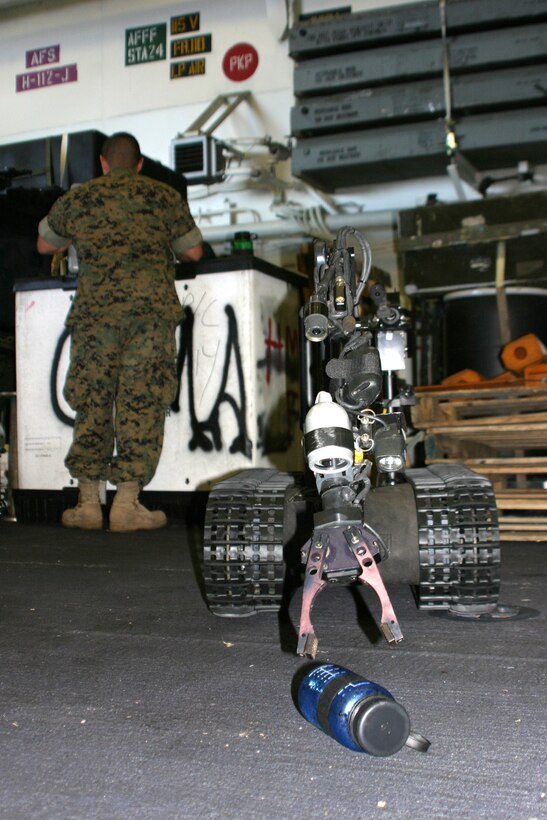 Marines with the 24th Marine Expeditionary Unit practice using a Talon 3B robotics system aboard the USS Iwo Jima.::n::The Marines are Explosive Ordnance Disposal Technicians assigned to MEU Service Support Group 24.::n::The 24th MEU, a versatile Air Ground Task Force that features several rifle companies, tanks, artillery and a reinforced helicopter squadron, is headed for the European and Central Command Theaters of Operations.