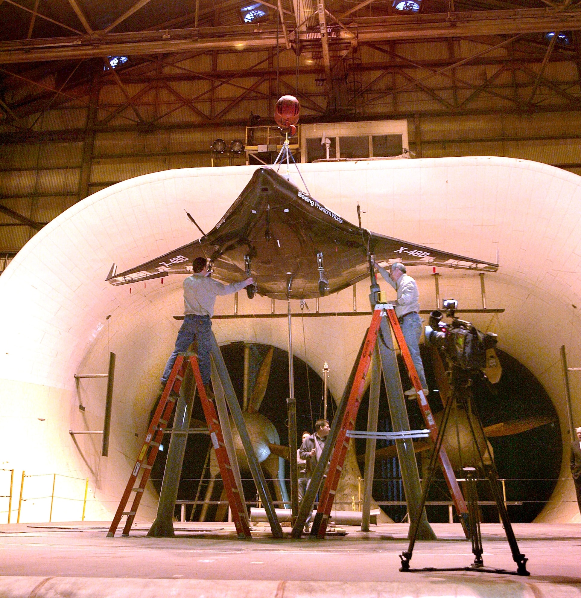 LANGLEY AIR FORCE BASE, Va.— Boeing, NASA and Cranfield Aerospace technicians complete installation of the first X-48B research aircraft at the Langley Full-Scale Tunnel. The test vehicle successfully completed 250 hours of wind tunnel testing in mid-May. (Courtesy photo)

