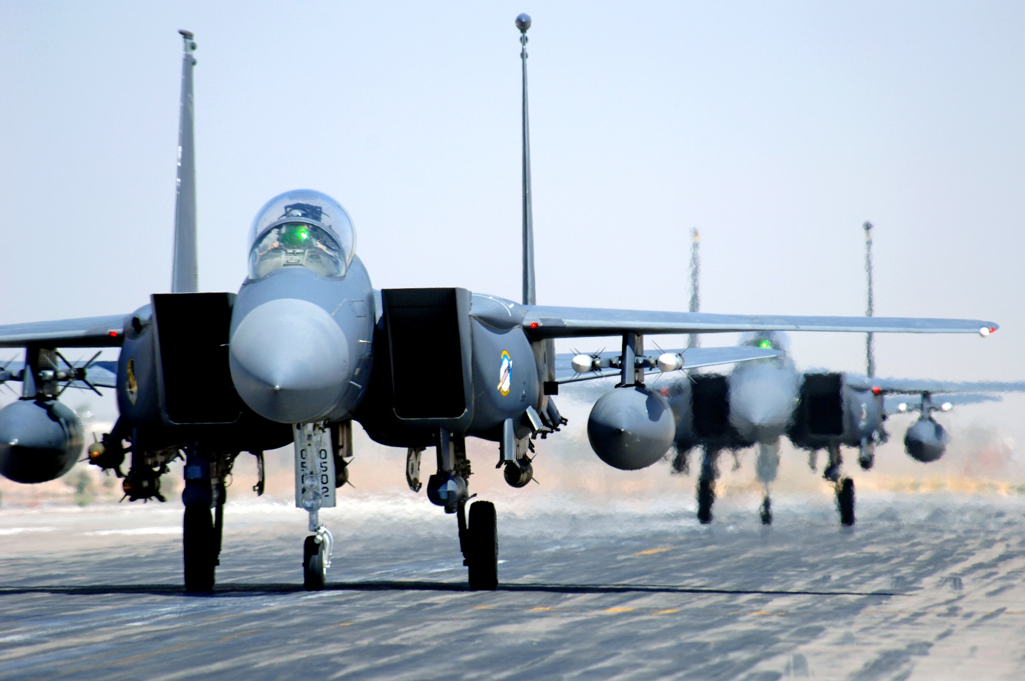 F-15E Strike Eagles taxi at Balad Air Base, Iraq, after an Operation Iraqi Freedom mission on Monday, June 12. The aircraft are deployed from Seymour Johnson Air Force Base, N.C. (U.S. Air Force photo/Staff Sgt. Tony R. Tolley) 