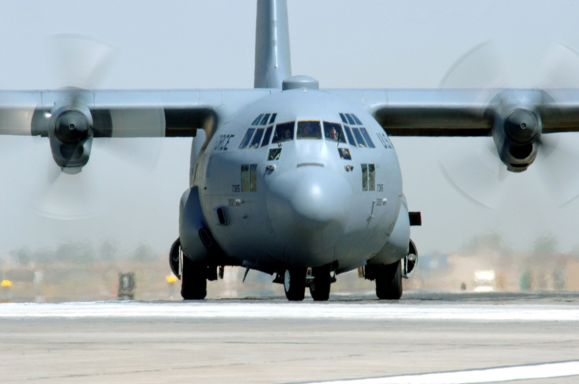 A C-130 Hercules taxis at Balad Air Base, Iraq, after an Operation Iraqi Freedom mission on Monday, June 12. The C-130 is deployed from the Colorado Air National Guard's 439th Airlift Wing in Colorado Springs. (U.S. Air Force photo/Staff Sgt. Tony R. Tolley)