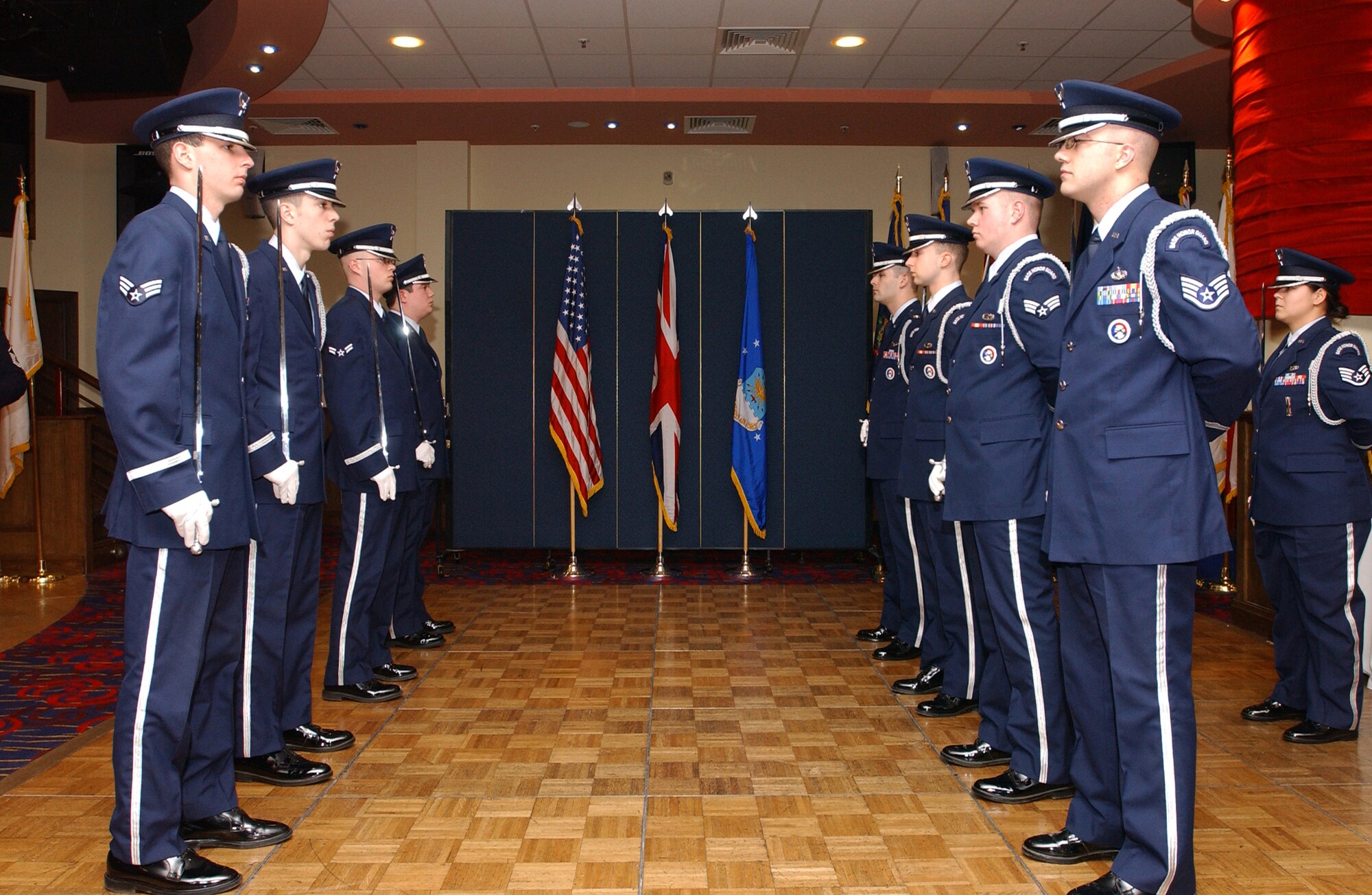 Members of the RAF Mildenhall Honor Guard team stand at ease after forming a sword cordon for annual award winners during a 100th Air Refueling Wing annual awards banquet Feb. 10 at the Galaxy Club.  (U.S. Air Force photo by Senior Airman Cecil McCloud)