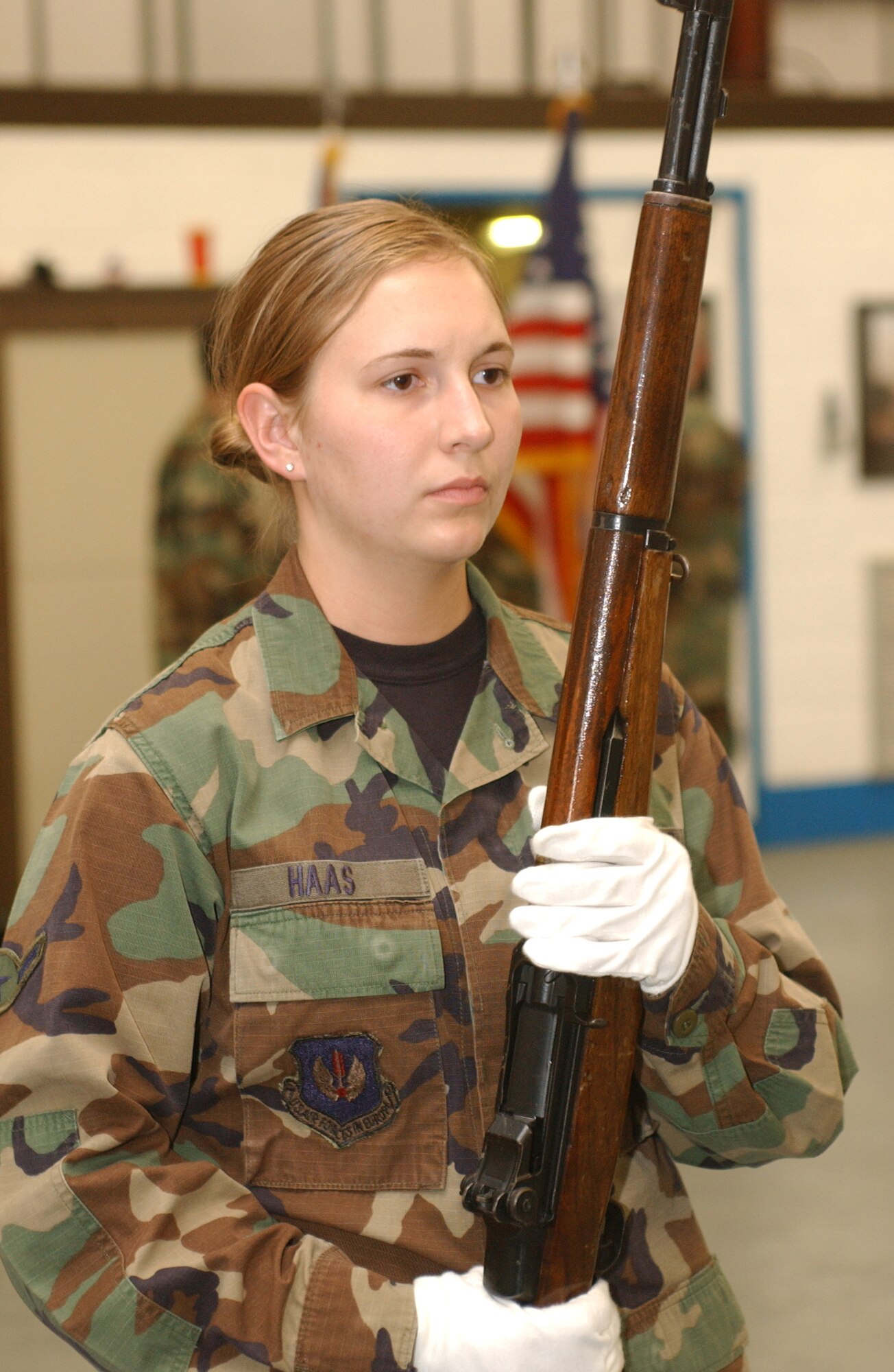 Airman Rachel Haas, 100th Logistics Readiness Squadron, practices basic rifle movements during honor guard practice April 26. She is in the second week of the six-week training program potential honor guard members must undergo before becoming full-fledged members of the RAF Mildenhall Honor Guard team. (U.S. Air Force photo by Senior Airman Cecil McCloud)