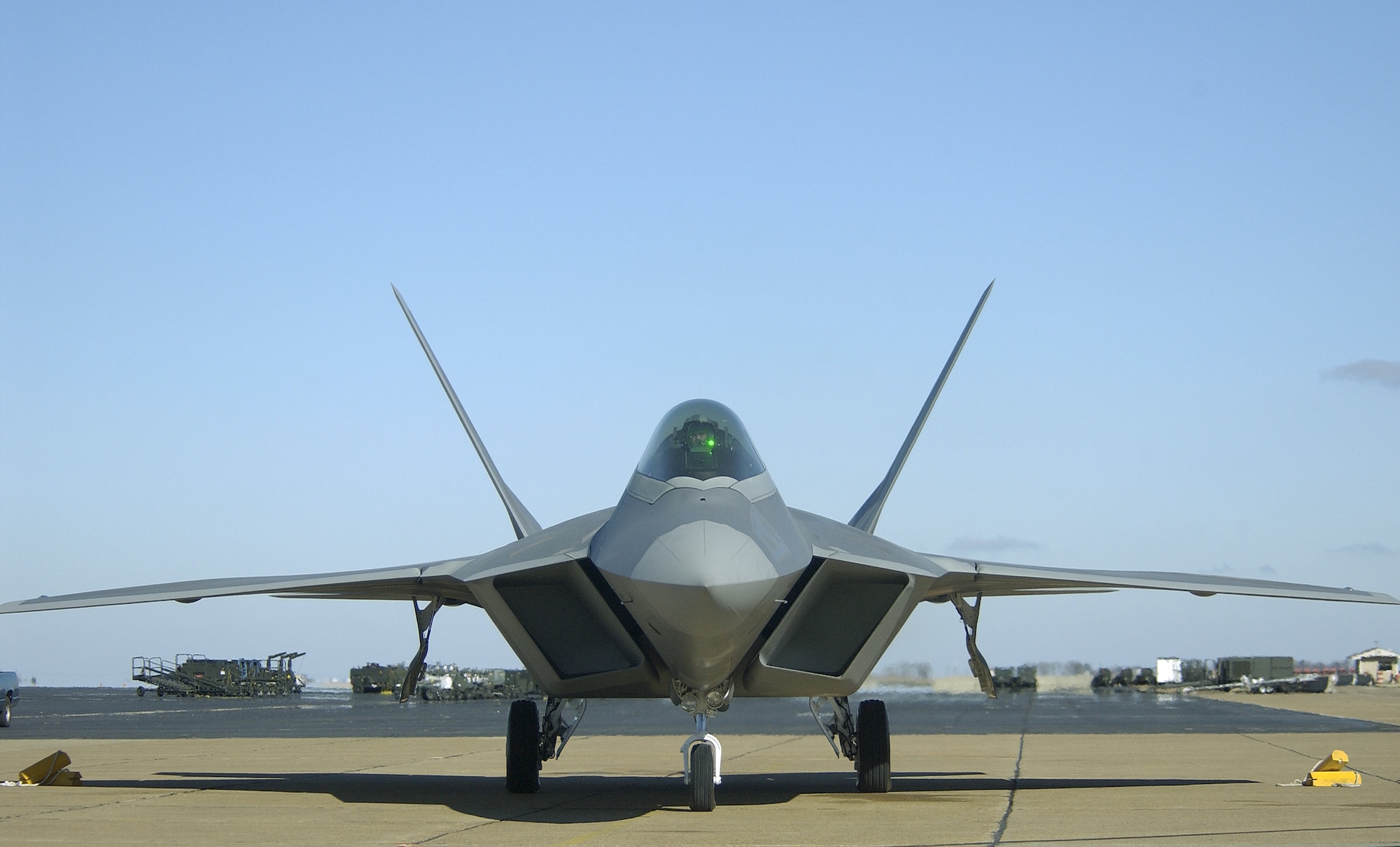 Major Charles "Corky" Corcoran, a 27th Fighter Squadron Fighter Pilot, prepares for his F-22A flight. The F-22A Raptor Stealth Fighter Jet made a historic flight from Langley Air Force Base, Virginia being its first generated sortie from Langley and piloted by a Langley based pilot. (US Air Force photo by Staff Sgt. V. Levi Collins)