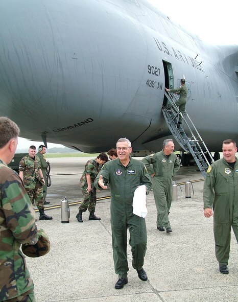 Maj. Gen. Martin Mazick, 22nd Air Force commander, walks on to the flight line to shake hands at Westover Air Reserve Base following his last training flight on a C-5 June 3. (U.S. Air Force photo/MSgt. W.C. Pope)