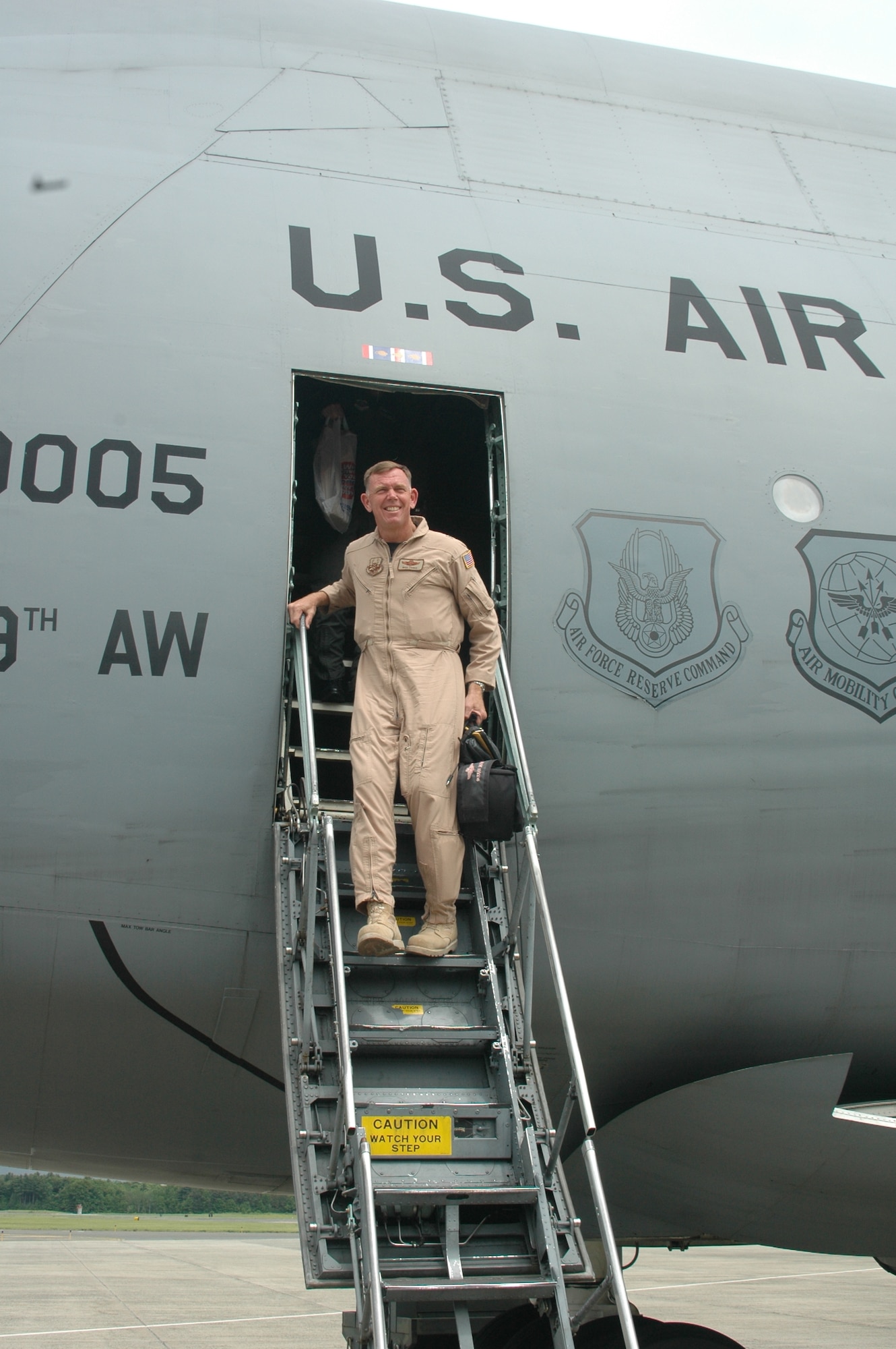 Brig. Gen. Wade Farris, 439th Airlift Wing commander, steps down from a Westover C-5 June 4 following his four-month deployment to a Southwest Asia location in support of Operation Iraqi Freedom. (U.S. Air Force photo/Tech Sgt. Andrew Biscoe)