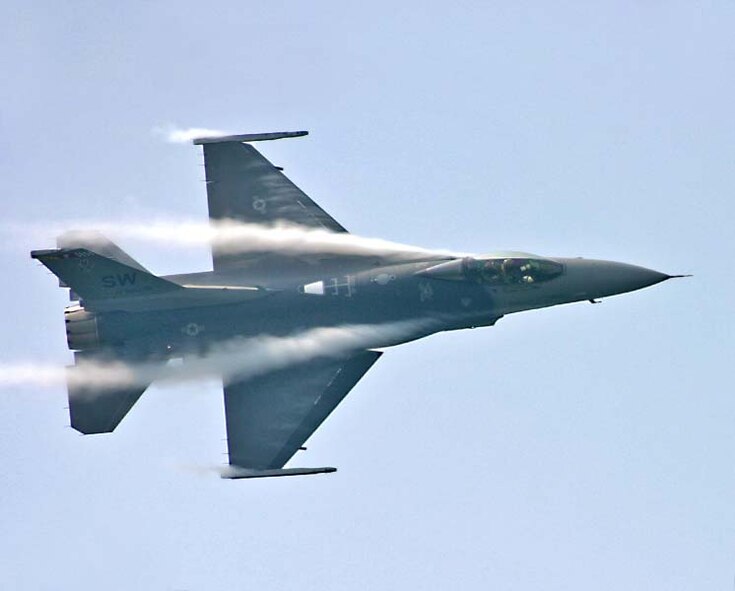 TITUSVILLE, FLORIDA-- The Viper East F-16 Demonstration jet completes a dedication pass March 11, 2005.   (U.S. Air Force Photo/Phyllis Lithenal)