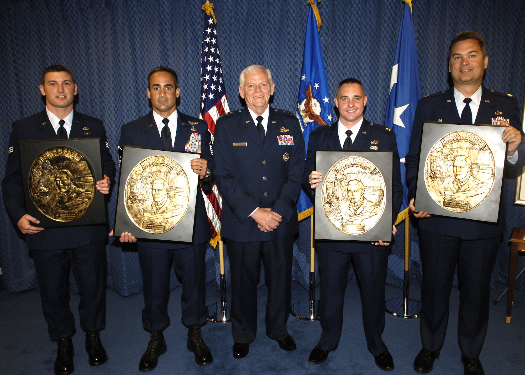 Lt. Gen. Arthur J. Lichte, Air Force assistant vice chief of staff and director of staff, is shown with the recipients of the 2005 Lance P. Sijan Air Force Leadership Award at the Pentagon on Tuesday, June 13. From left are: Senior Airman Grailin Blamer, Fort Lewis, Wash.; Master Sgt. Ramon Colon-Lopez, Kirtland Air Force Base, N.M.; General Lichte; Capt. William Dains, Wright-Patterson AFB, Ohio; and Lt. Col. Gerald Ven Dange, Defense Contract Management Agency West at Redondo Beach, Calif. (U.S. Air Force photo/Donna Parry)