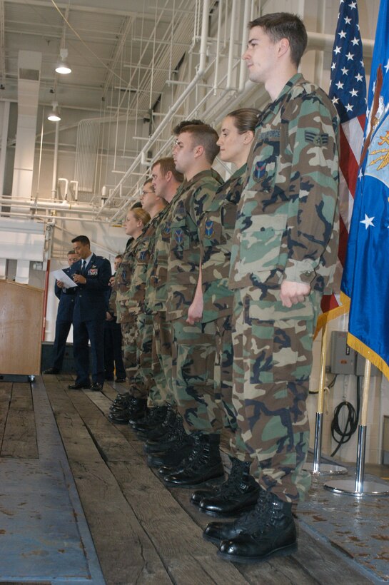 Colonel Michael Kim, 22nd Air Force Vice Commander, reads a congratulatory letter from Air Force Reserve Commander Major General Allan Poulin to the members of the 758th Life Support  Section awarding the team as Air Force Reserve Command Life Support Section of the Year for 2005