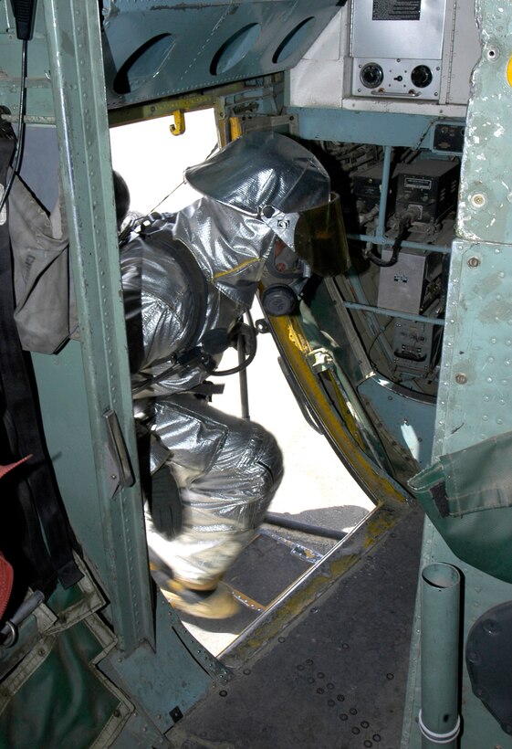 Staff Sgt. Duane Nicol enters a C-130 Hercules during egress training at a deployed location in Southwest Asia on Wednesday, June 14. The firefighter is assigned to the 386th Expeditionary Civil Engineer Squadron and is deployed from Shaw Air Force Base, S.C. (U.S. Air Force photo/Staff Sgt. Ryan Hansen)                   