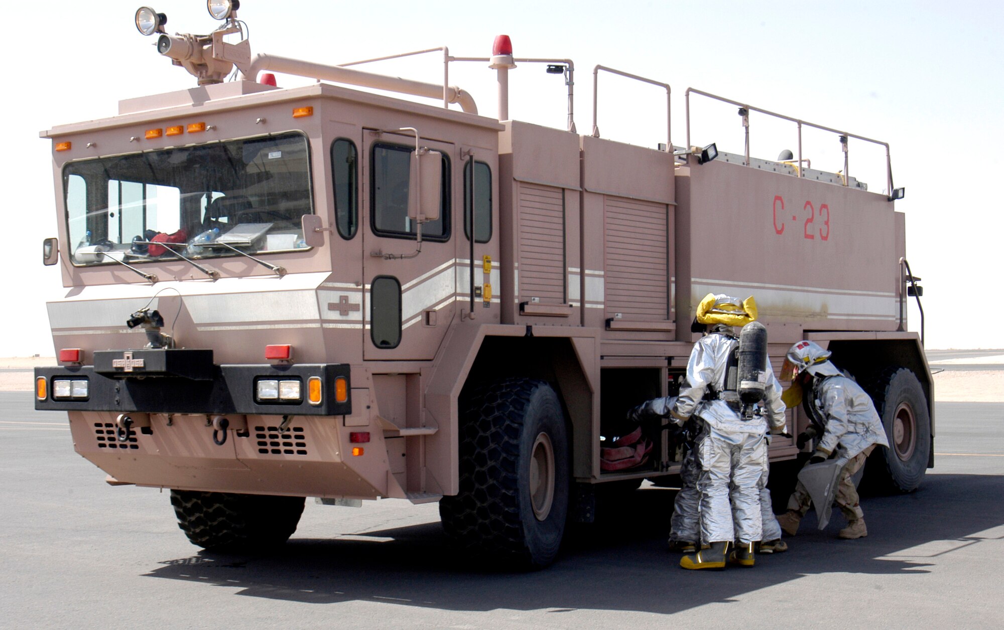 Firefighters from the 386th Expeditionary Civil Engineer Squadron prepare their gear for C-130 Hercules egress training at a deployed location in Southwest Asia on Wednesday, June 14. (U.S. Air Force photo/Staff Sgt. Ryan Hansen)
