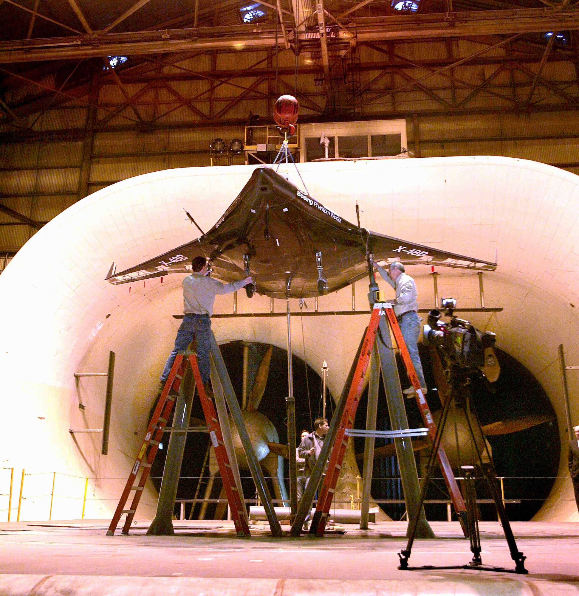 Technicians from Boeing, the National Aeronautics and Space Administration and Cranfield Aerospace complete installation of the first X-48B research aircraft at the full scale wind tunnel at NASA's research center at Langley Air Force Base, Va. (Courtesy photo)
