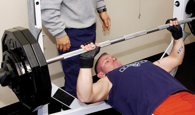 Nate Tueting, 4th Space Operations Squadron, presses 245 pounds to place fourth in the Schriever bench press competition at the Main Fitness Center here Friday. Steve Cruz, 2nd SOPS, won the men's event by pressing 175 percent of his body weight, or 365 pounds. Sunny Norwood won for the women with 122 percent, or 170 pounds.