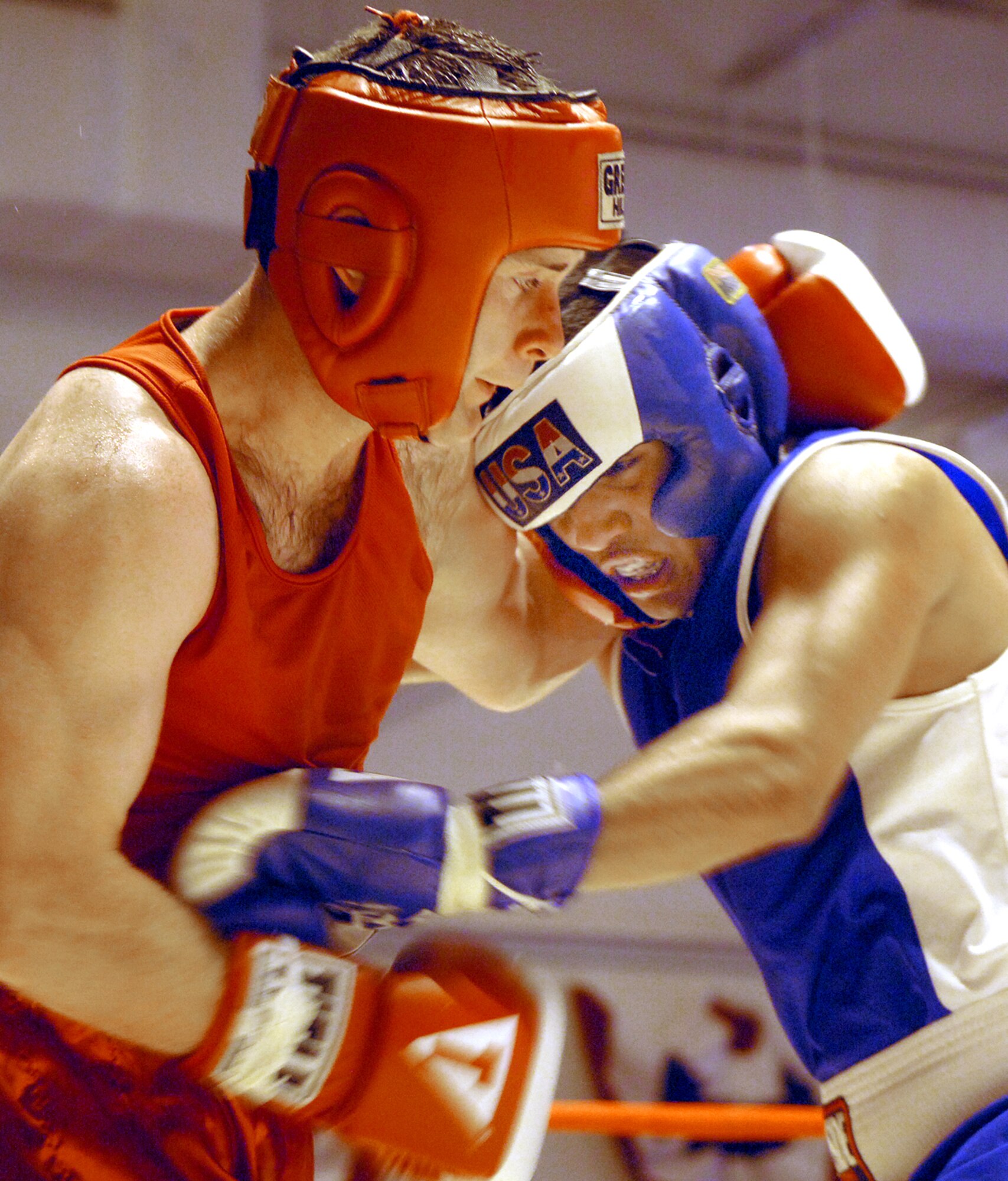 Senior Airman Pete Villarreal blocks a punch from Royal Air Force Senior Aircraftsman Anthony Carroll in the second round of their match at the Boxing Royale at the Bennett Fitness Center in San Antonio on Saturday, June 10. The event featured RAF boxers competing against U.S. military and local boxers. Airman Villarreal won by decision. (U.S. Air Force photo/Tech. Sgt. Larry A. Simmons)
