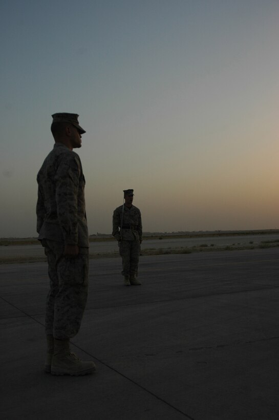 Corporals enrolled in the Corporal's Course held by Marine All-Weather Fighter Attack Squadron 533, Marine Aircraft Group 16 (Reinforced), 3rd Marine Aircraft Wing, practice drill on the flight line at Al Asad, Iraq, June 15. The corporals learn how to march a platoon along with other skills needed to lead junior Marines, both in battle and in their respective military occupational specialties.