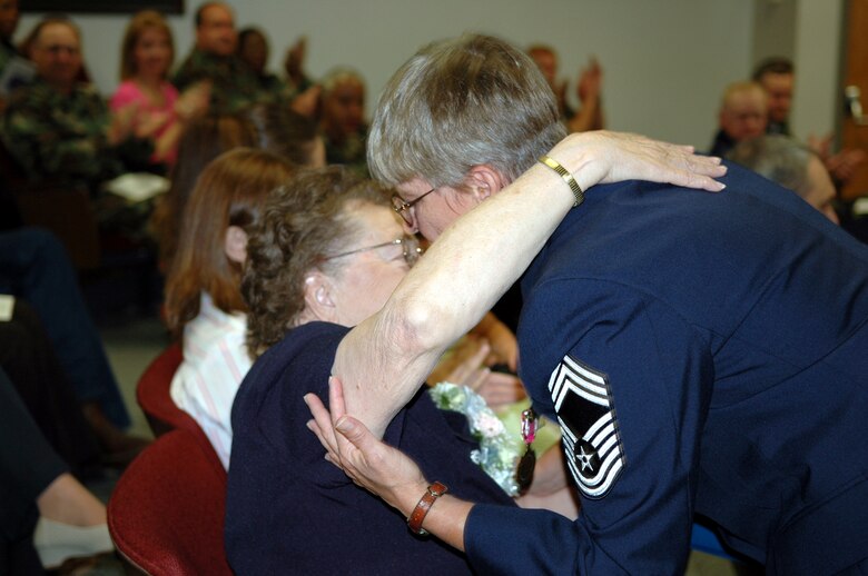 Chief Master Sgt. Marion Aaberg, 917th Military Personnel Flight chief, hugs her mother, Frances, during her retirement ceremony at the Wing Saturday, May 6. (Photo by Staff Sgt. Ebony Nichols)