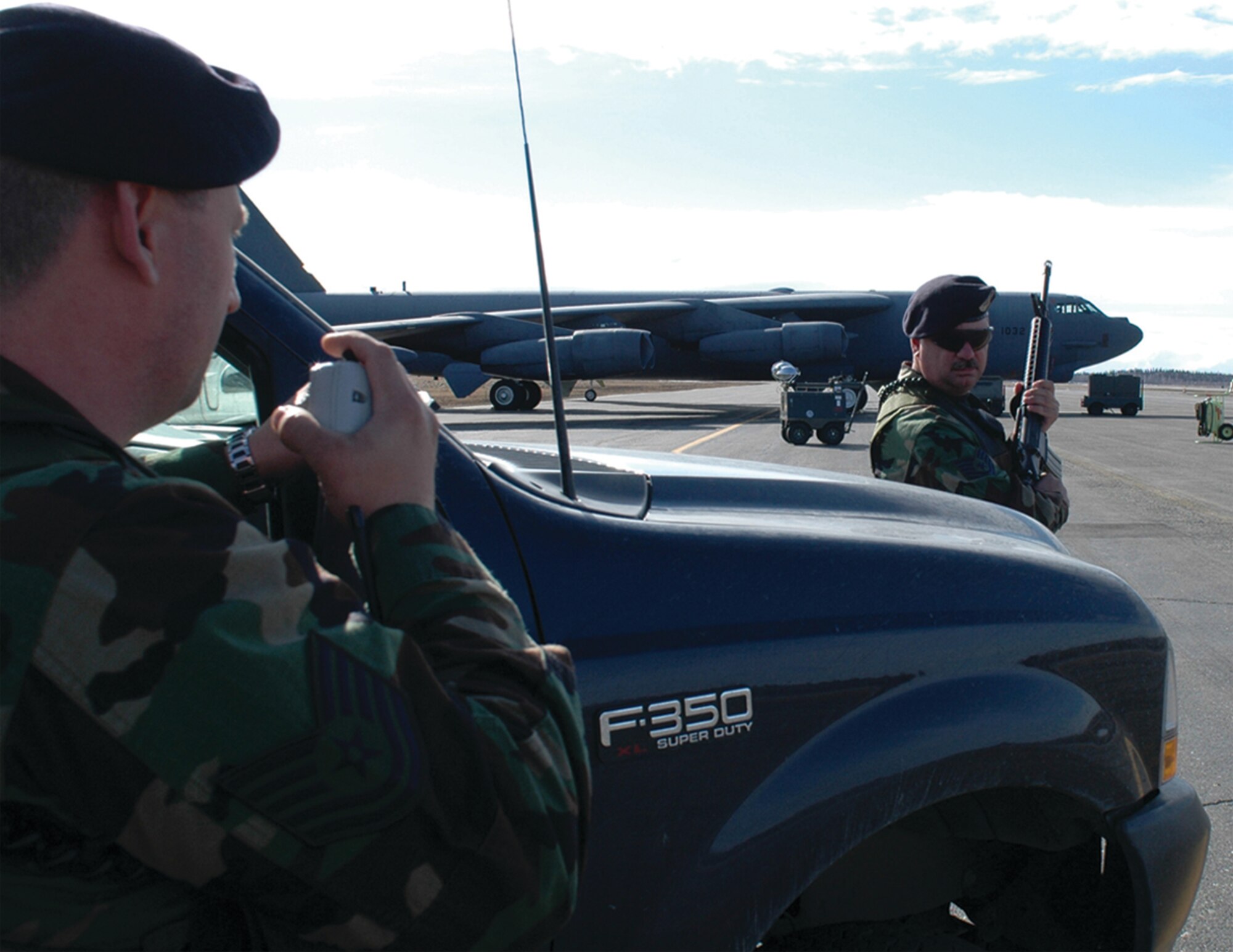 Tech Sgts. Chad Turner and Robert Jackson, 917 Security Forces Squadron members, check in before changing positions on the flight line at Eielson AFB, Alaska during RED FLAG - Alaska 06-2.  (Photo by Tech. Sgt. Jeff Walston)