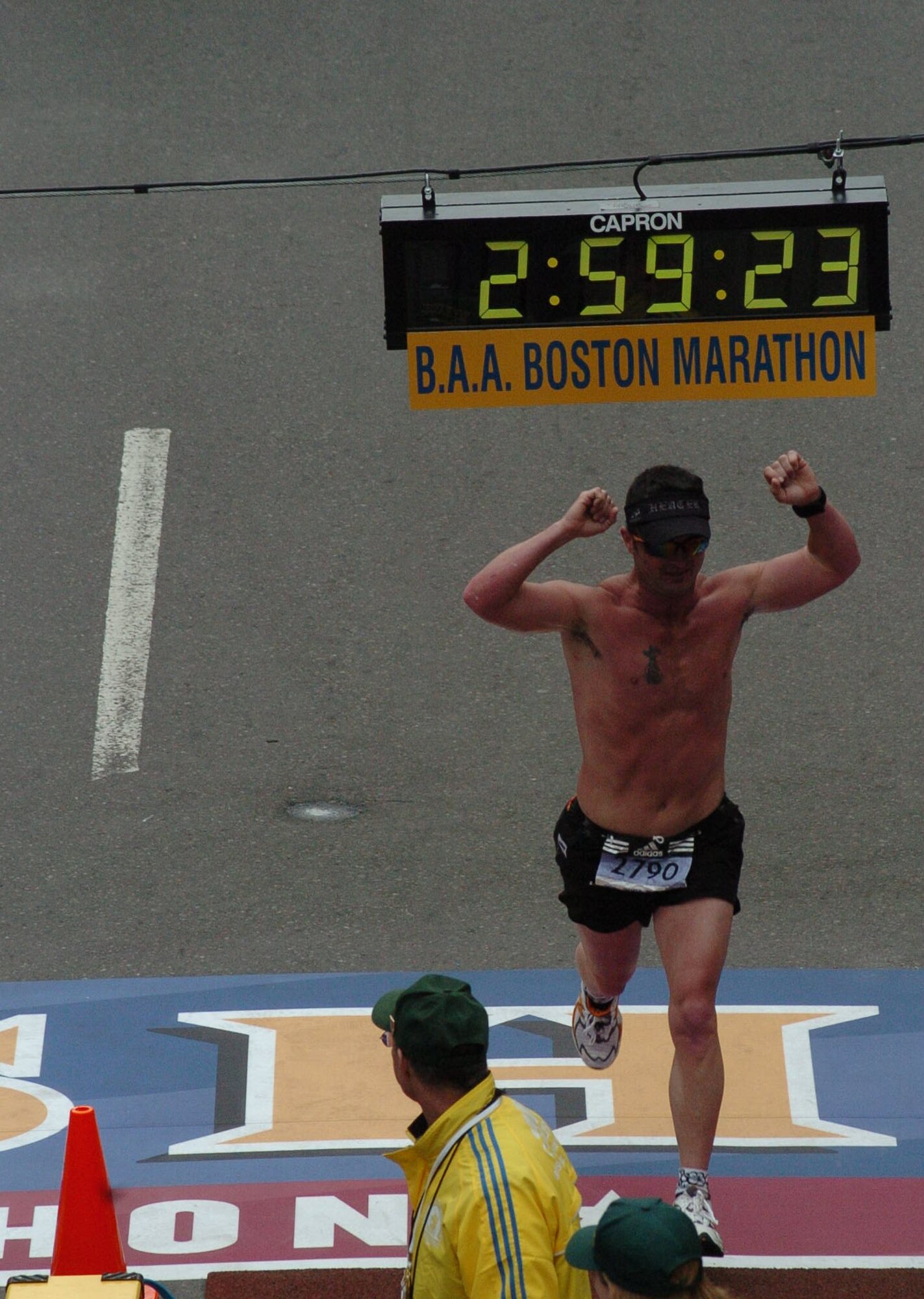 Heath White, a captain and B-52 aircraft commander with the 93rd Bomb Squadron, crosses the finish line at this year's Boston Marathon Monday, April 17. (Photo courtesy of Marathon Foto). 