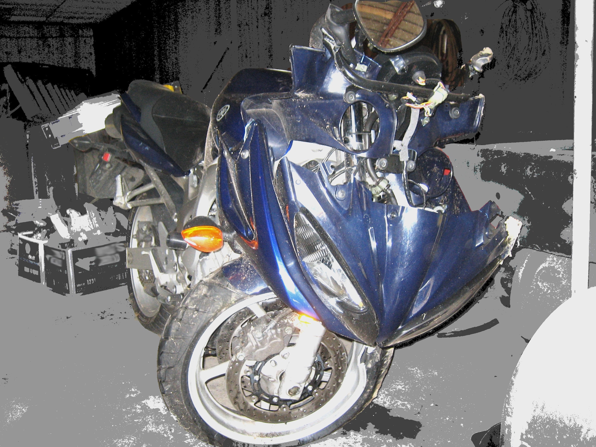 YOUNGSTOWN AIR RESERVE STATION, Ohio - Shown in a photo taken by Master Sgt. Alan Navecky, Jr., a ground safety manager here, the damaged motorcycle ridden by his son Alan Navecky, III suggests how devastating the younger Mr. Navecky's injuries might have been if he had not been wearing the proper personal protection equipment.