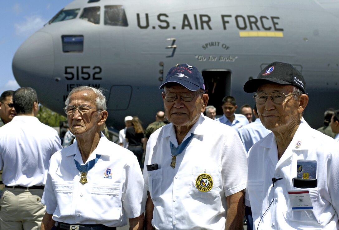 Barney Hajiro and Shizuya Hayashi, Medal of Honor recipients, and Ed Ichiyama pose in front of a C-17 Globemaster III named "The Spirit of 'Go for Broke'" during an arrival ceremony at Hickam Air Force Base, Hawaii, on Wednesday, June 14. The men are veterans of the 442nd Combat Regimental Team. The aircraft is named in honor of their unit. (U.S. Air Force photo/Tech. Sgt. Shane A. Cuomo)
