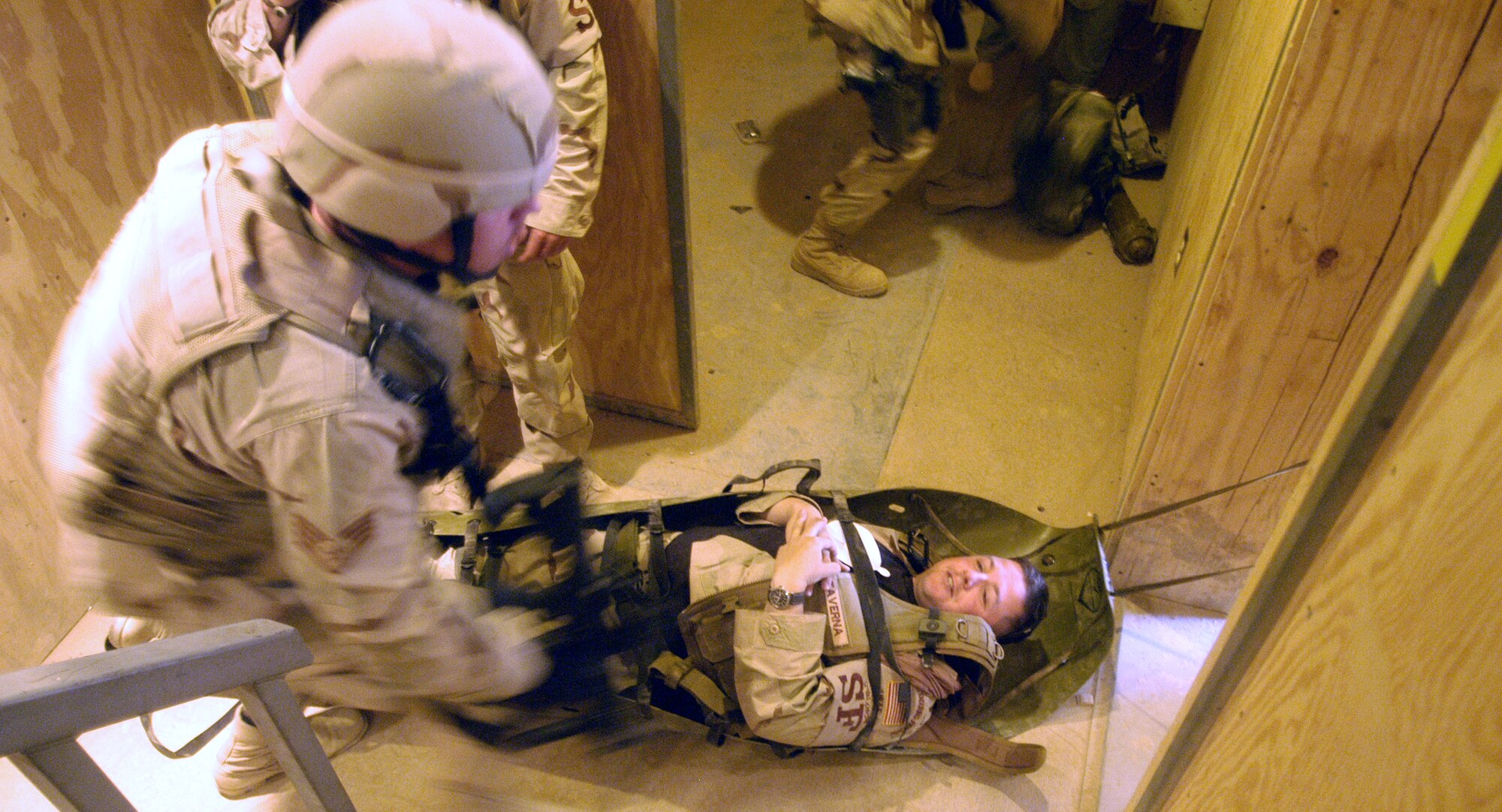 Tech. Sgt. Robert Taverna role-plays as a wounded Airman during a security forces combat lifesaver exercise at Bagram Air Base, Afghanistan, on Thursday, June 15. It's the job of his squad mates, including Staff Sgt. Thomas McMahon (left), to transport the litter he is on to a waiting ambulance. Both sergeants are deployed to the 455th Expeditionary Security Forces Squadron from the 514th Air Mobility Wing at McGuire Air Force Base, N.J. (U.S. Air Force photo/Maj. David Kurle)