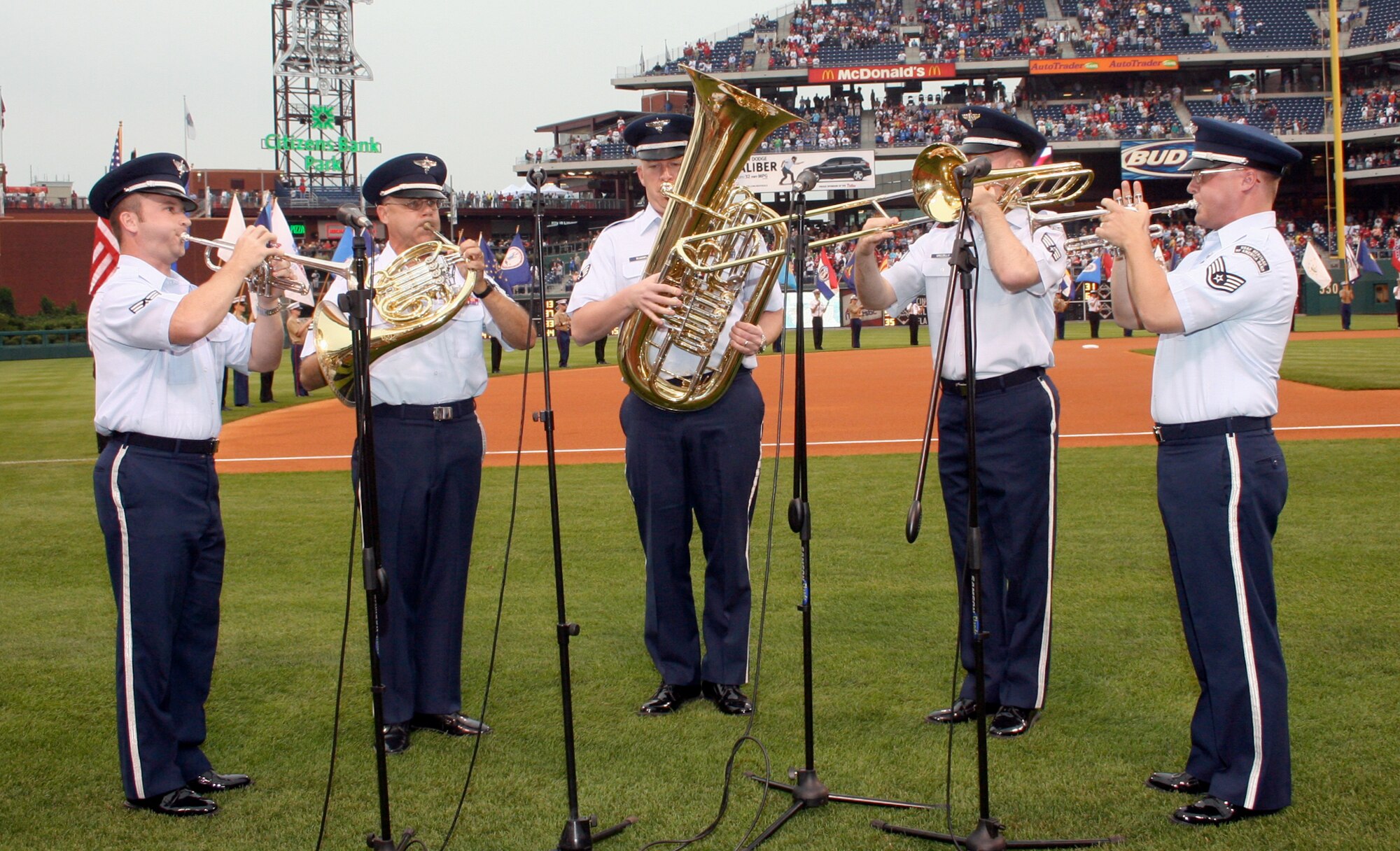 PHILADELPHIA, Pa. (ACCNS) – From left to right, Senior Airman Gary Holmes, Tech. Sgt. David Crites, Senior Airman Andrew Rummel, Senior Airman Joel Grizzelle and Staff Sgt. Mark Nixon, ACC Heritage of America Brass Quintet Band, perform by playing the national anthem Wednesday, June 14, for the Philadelphia Phillies. This performance was the final activity in the "Salute the Military" pre-game ceremony. (Photo by Heddy Bergsman, Philadelphia Phillies)