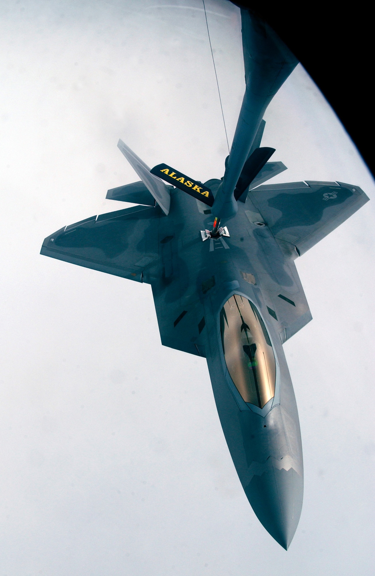 OVER ALASKA (ACCNS) -- An F-22A Raptor from the 27th Fighter Squadron, Langley Air Force Base, Virginia is refueled by a KC-135R Stratotanker from the 168th Air Refueling Wing, Alaska Air National Guard, on 9 June during exercise Northern Edge. Northern Edge 2006 is a joint training exercise hosted by Alaskan Command and is one of a series of U.S. Pacific Command exercises that prepare joint forces to respond to crises in the Asian Pacific region. (U.S. Air Force Photo/Staff Sgt. Joshua Strang)
