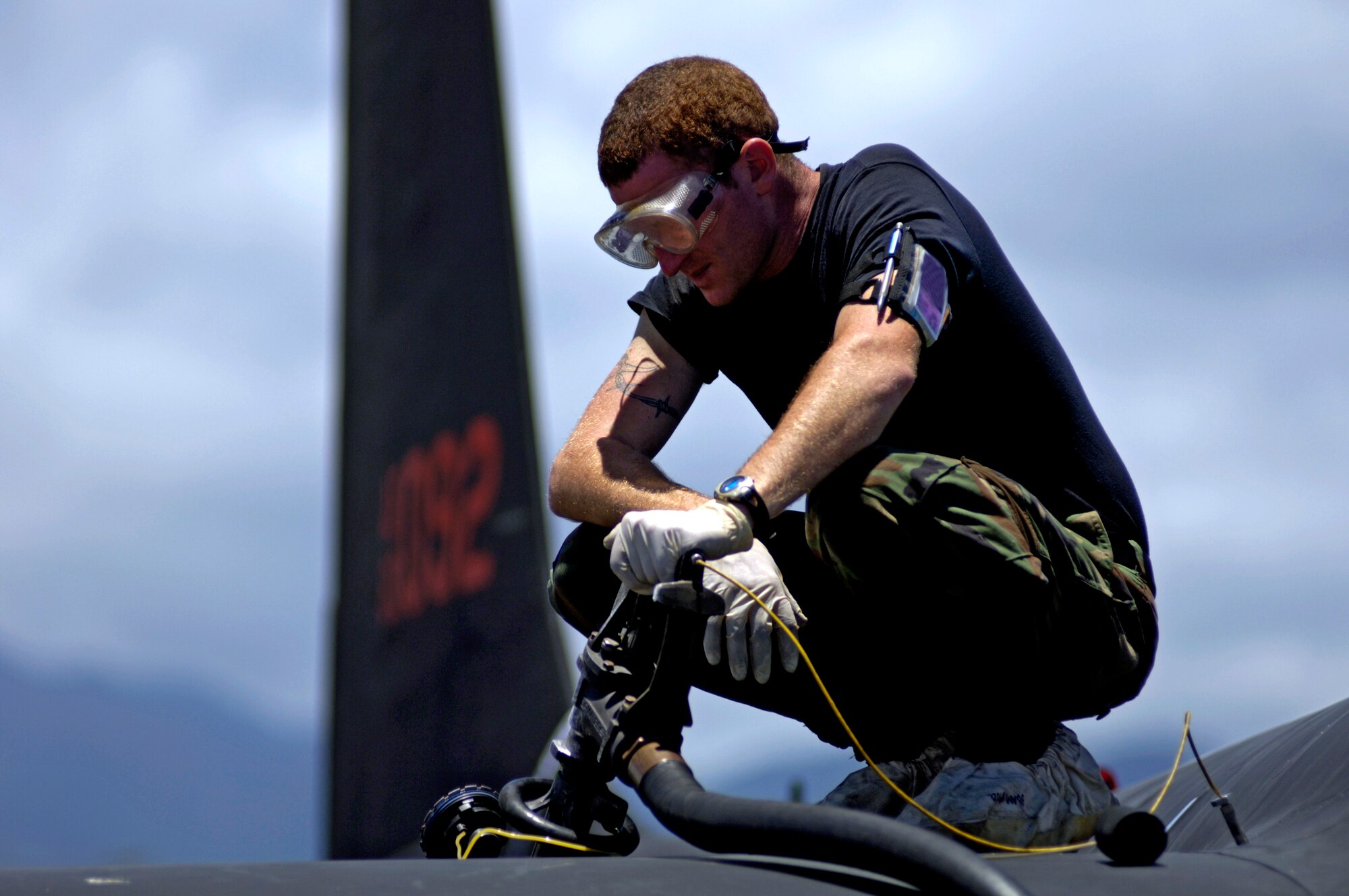 Senior Airman Justin Smith fuels a U-2 Dragon Lady at Hickam Air Force Base, Hawaii, on Tuesday, June 13. The aircraft is en route to South Korea. U-2s are undergoing a $1.5 billion upgrade. Cockpit instruments will be modernized with full-color displays that replace gauges and dials with state-of-the-art, touch-screen technology. Airman Smith is a crew chief from 9th Maintenance Squadron, Beale AFB, Calif. (U.S. Air Force photo/Tech. Sgt. Shane A. Cuomo)