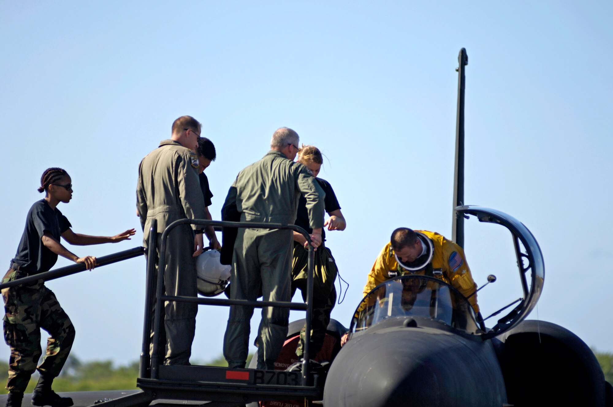 Airmen from the 9th Reconnaissance Wing at Beale Air Force Base, Calif., help their pilot out of a U-2 Dragon Lady at Hickam AFB, Hawaii, on Tuesday, June 13. The aircraft is en route to South Korea. U-2s are undergoing a $1.5 billion upgrade. Cockpit instruments will be modernized with full-color displays that replace gauges and dials with state-of-the-art, touch-screen technology. (U.S. Air Force photo/Tech. Sgt. Shane A. Cuomo)