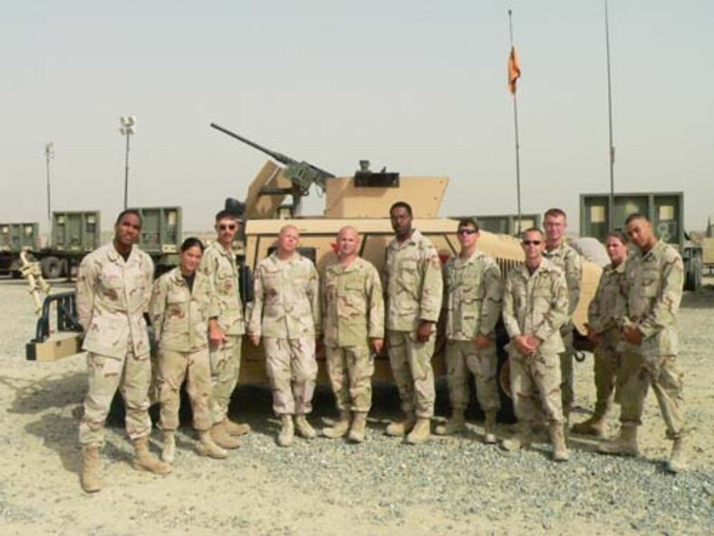 Airmen from the 20th Logistics Readiness Squadron pose by a vehicle during their time as convoy drivers in Iraq.  The Airmen recently returned to Shaw.  (Courtesy photo)
