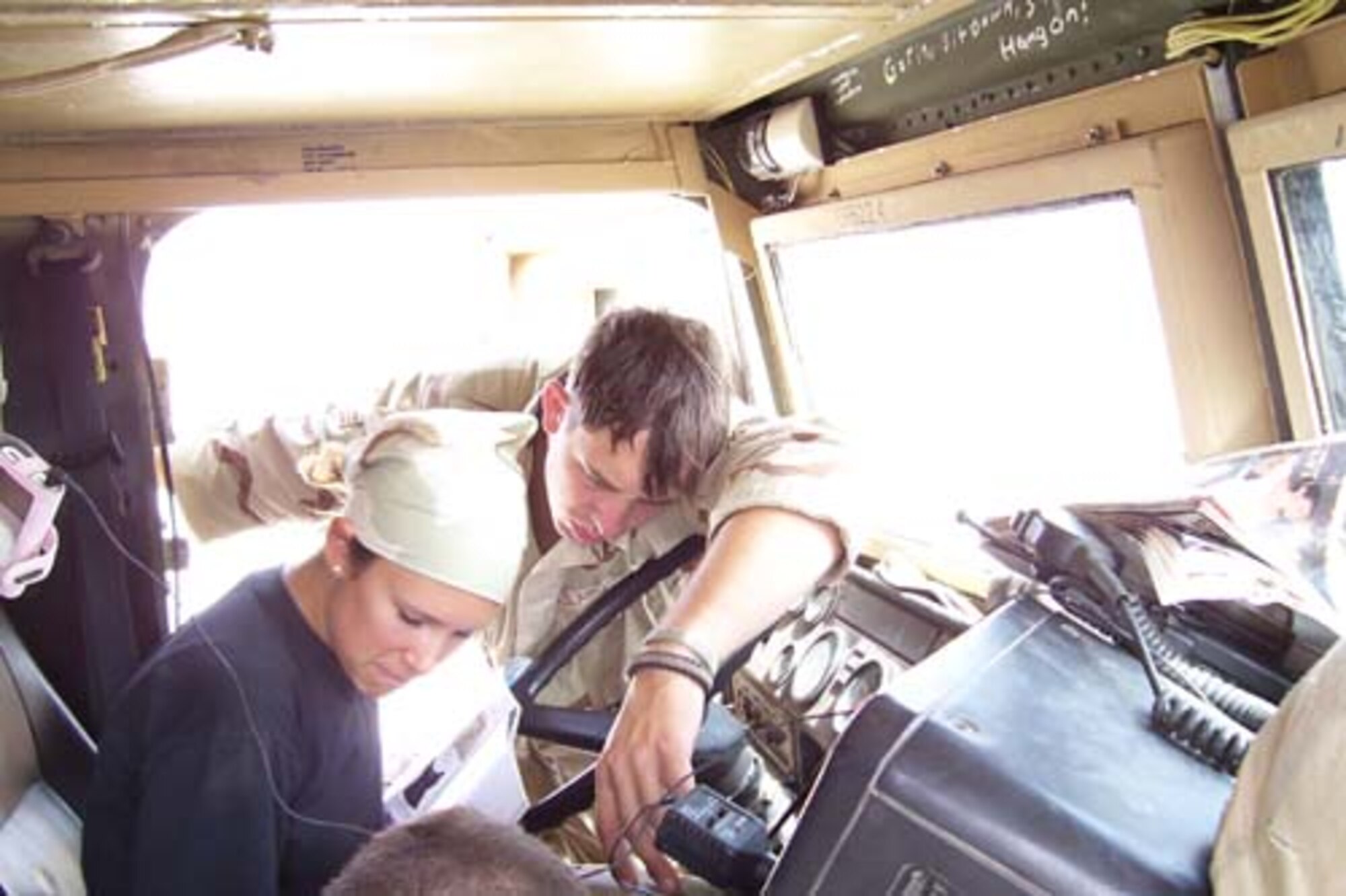 Senior Airman Randy Shamblin, 20th LRS vehicle operator, instructs a fewllow Airman on how to operate an on-board computer.  (Courtesy photo)