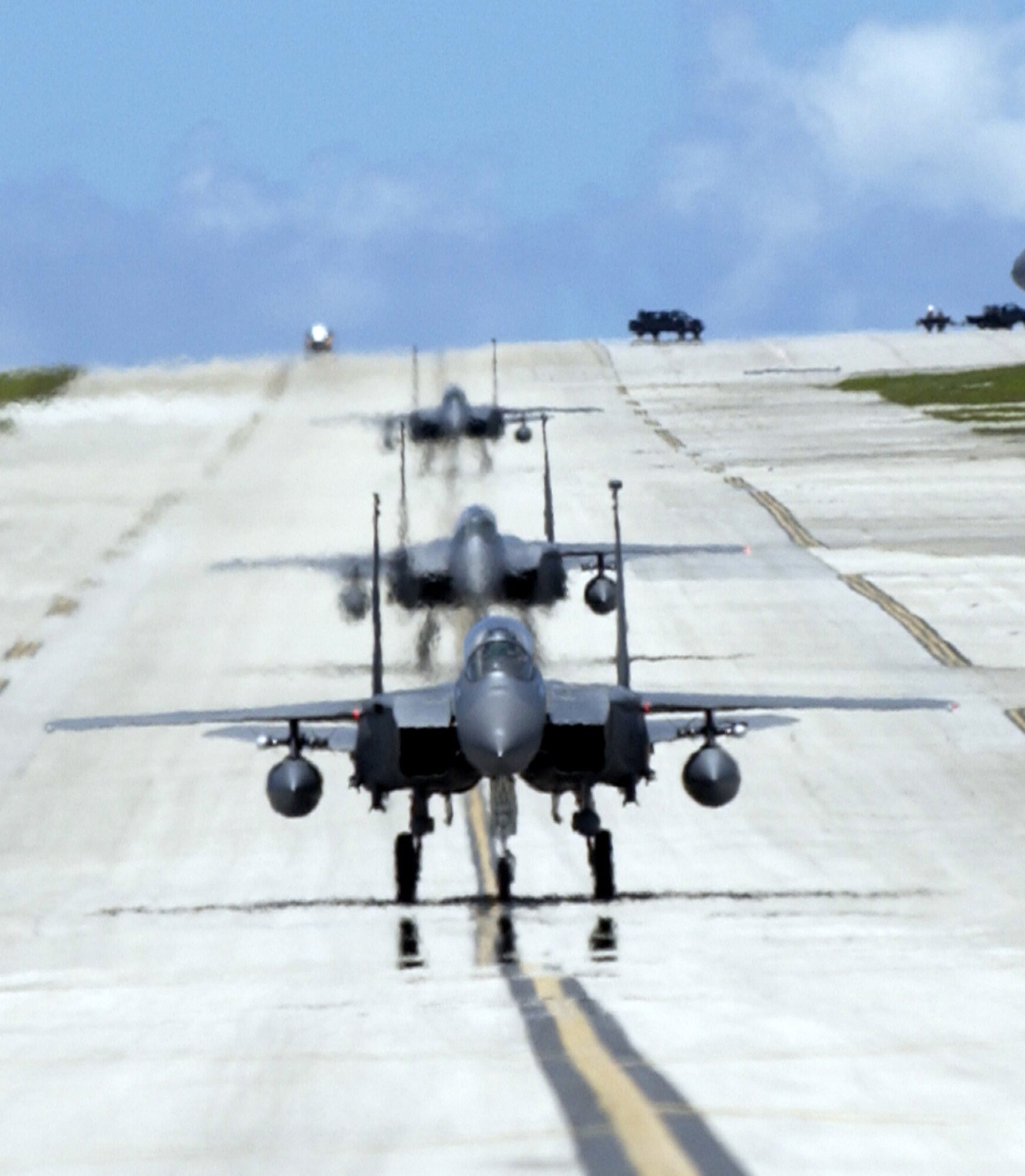 ANDERSEN AIR FORCE BASE, Guam -- F-15E Strike Eagles from the 90th Expeditionary Fighter Squadron taxi to their parking spots on Andersen Air Force Base, Guam. Deployed from Elmendorf Air Force Base, Alaska, the 90th EFS is participating in exercise Valiant Shield 2006. Valiant Shield begins June 19 and lasts through June 23, and will be conducted in the vicinity of Guam. Valiant Shield focuses on integrated joint training among US military forces. (U.S. Air Force photo by Airman 1st Class Michael Dorus)