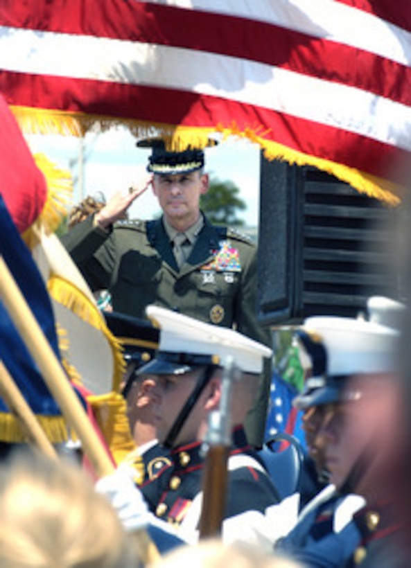 Chairman of the Joint Chiefs of Staff Gen. Peter Pace, U.S. Marine Corps, salutes as the National Anthem is played during groundbreaking ceremonies for the Pentagon Memorial on June 15, 2006. The Pentagon Memorial will commemorate the 184 people killed in the Pentagon and on American Airlines Flight 77 on September 11, 2001. 