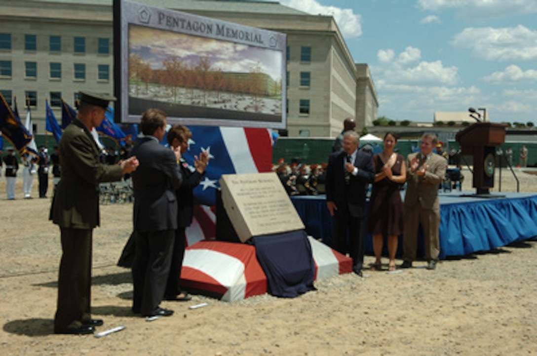 Chairman of the Joint Chiefs of Staff Gen. Peter Pace, U.S. Marine Corps, Jim Laychak, Rosemary Dillard, Secretary of Defense Donald H. Rumsfeld, Julie Beckman and Keith Kaseman applaud after unveiling an inscribed stone during groundbreaking ceremonies for the Pentagon Memorial on June 15, 2006. The Pentagon Memorial will commemorate the 184 people killed in the Pentagon and on American Airlines Flight 77 on September 11, 2001. Laychak is the President of the Pentagon Memorial Fund and Dillard is the Vice President of the Pentagon Memorial Fund. Beckman and Kaseman are the memorial concept designers. 