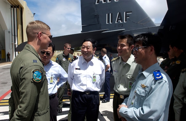ANDERSEN AIR FORCE BASE, Guam -- Members of the Chinese foreign observer team ask questions about the F-15, during Valiant Shield '06, from an American representative. Foriegn observers were present from China, Russia, India, Australia, the Republic of Korea, Singapore, and Japan. Valiant Shield begins June 19 and lasts through June 23, and will be conducted in the vicinity of Guam. Valiant Shield focuses on integrated joint training among US military forces. (U.S. Air Force photo by Airman First Class Michael S. Dorus) 