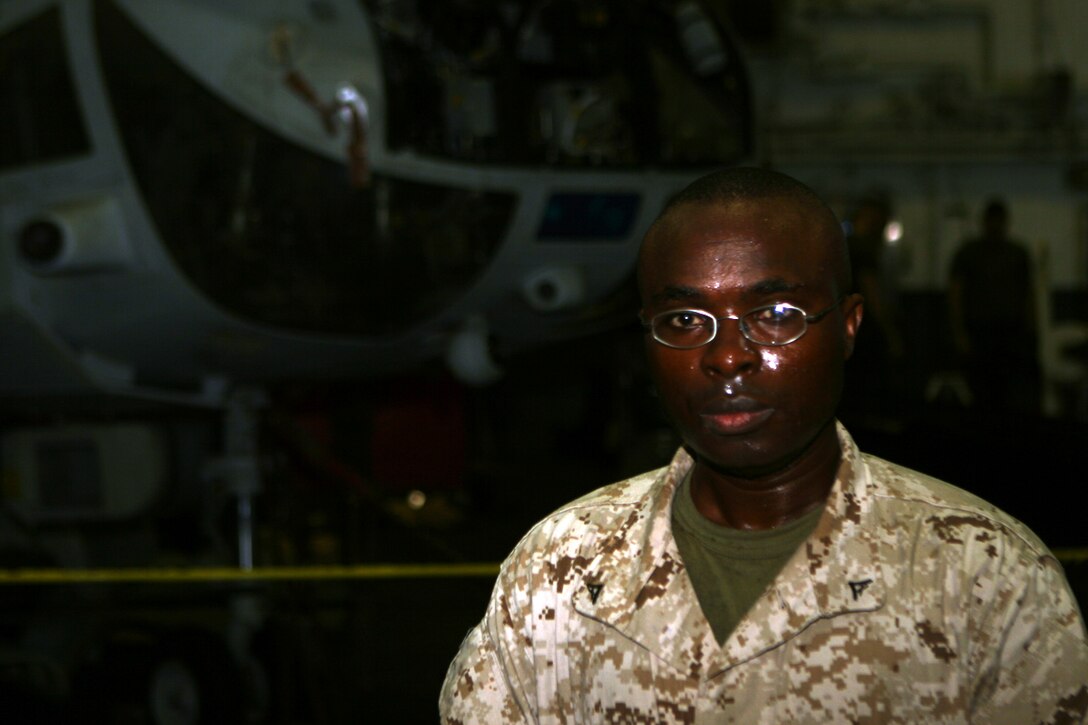 ABOARD USS PELELIU (LHA 5) (Aug. 8,2008) -- Lance Cpl. Eric Hirwa, an aircraft mechanic with Marine Medium Helicopter Squadron-165, emigrated to the United States after being rescued from the Rwandan civil war with help from U.S. Marine Embassy Guards in 1994.::r::::n::   After arriving in the U.S. in 2001, Hirwa earned a degree in mechanical engineering before fulfilling a pledge of entering the Marine Corps, joining in October 2006.::r::::n::   The Camp Pendleton, Calif. based 15th MEU is comprised of approximately 2,200 Marines and Sailors and is a forward deployed force of readiness capable of conducting numerous operations, such as Non-Combatant Evacuation Operations, Humanitarian Assistance Operations and a wide range of amphibious missions. The 15th MEU is currently deployed aboard the USS PELELIU (LHA-5), USS DUBUQUE (LPD-8) and USS PEARL HARBOR (LSD-52).::r::::n::(Official U.S. Marine Corps photo by Cpl. Timothy T. Parish)(RELEASED)
