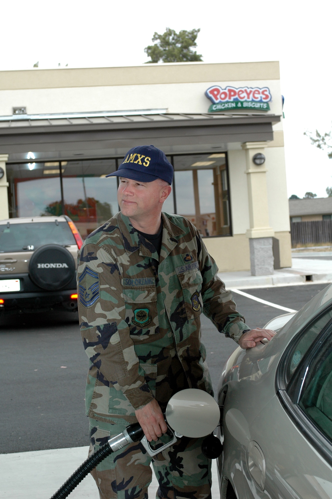 Senior Master Sgt. Milton Solorzano, 60th Aircraft Maintenance Squadron, puts gas in his car at the new shoppette. The shoppette opened Sunday in order to test its services and work out any possible kinks in the systems. The grand opening will be within the next two months. The hours of operation are from 6 a.m. to midnight daily. (U.S. Air Force photo by Jennifer Brugman)

