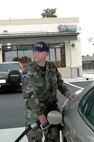 Senior Master Sgt. Milton Solorzano, 60th Aircraft Maintenance Squadron, puts gas in his car at the new shoppette. The shoppette opened Sunday in order to test its services and work out any possible kinks in the systems. The grand opening will be within the next two months. The hours of operation are from 6 a.m. to midnight daily. (U.S. Air Force photo by Jennifer Brugman)

