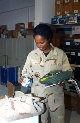 Staff Sgt. Cidelia Hagan checks kits during an inventory at Ali Base, Iraq, on Monday, June 12. She is assigned to the 407th Expeditionary Communications Squadron communication focal point. (U.S. Air Force photo/Master Sgt. Andrew Gates) 