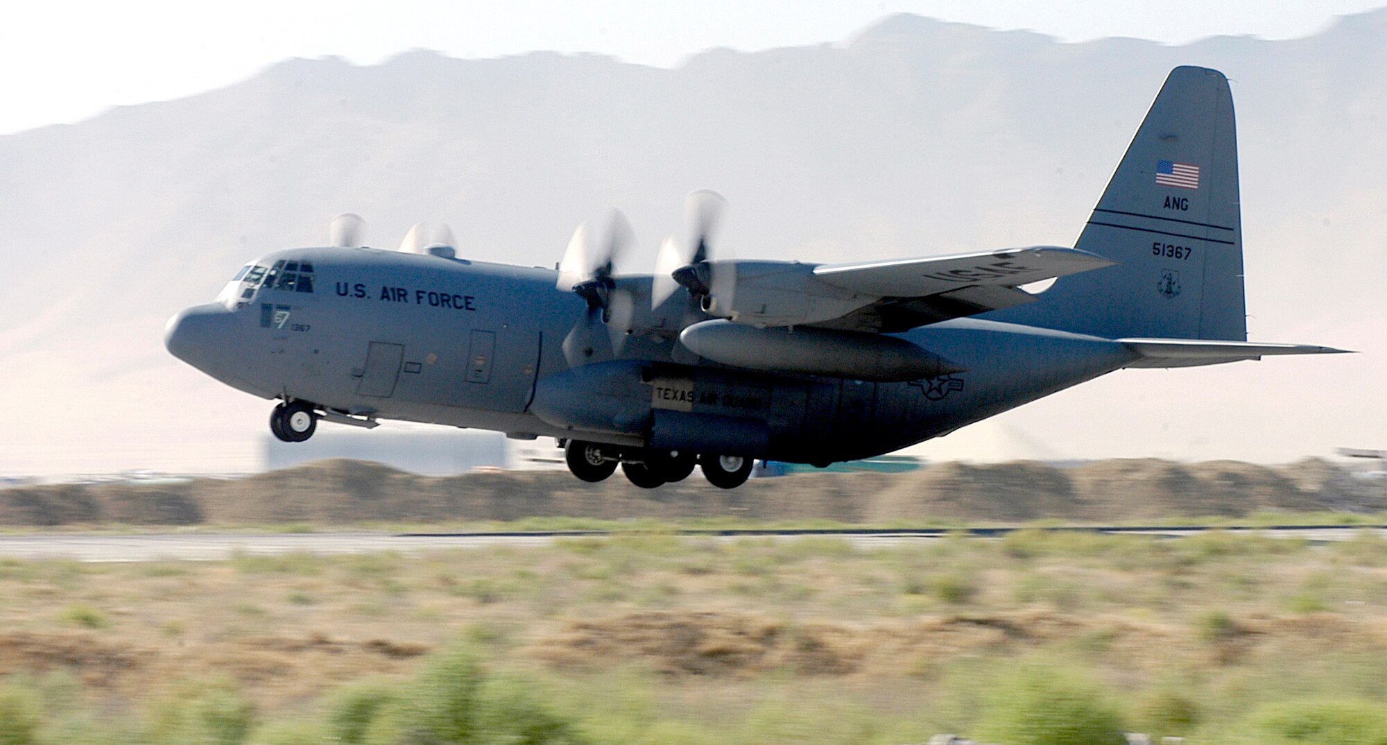 A C-130 Hercules from the Texas Air National Guard takes off from Bagram Air Base, Afghanistan, on Wednesday, June 14. The 744th Expeditionary Airlift Squadron comprises Air National Guard units throughout the United States. They fly airlift and airdrop missions from Bagram in support of Operation Enduring Freedom. (U.S. Air Force photo/Maj. David Kurle)