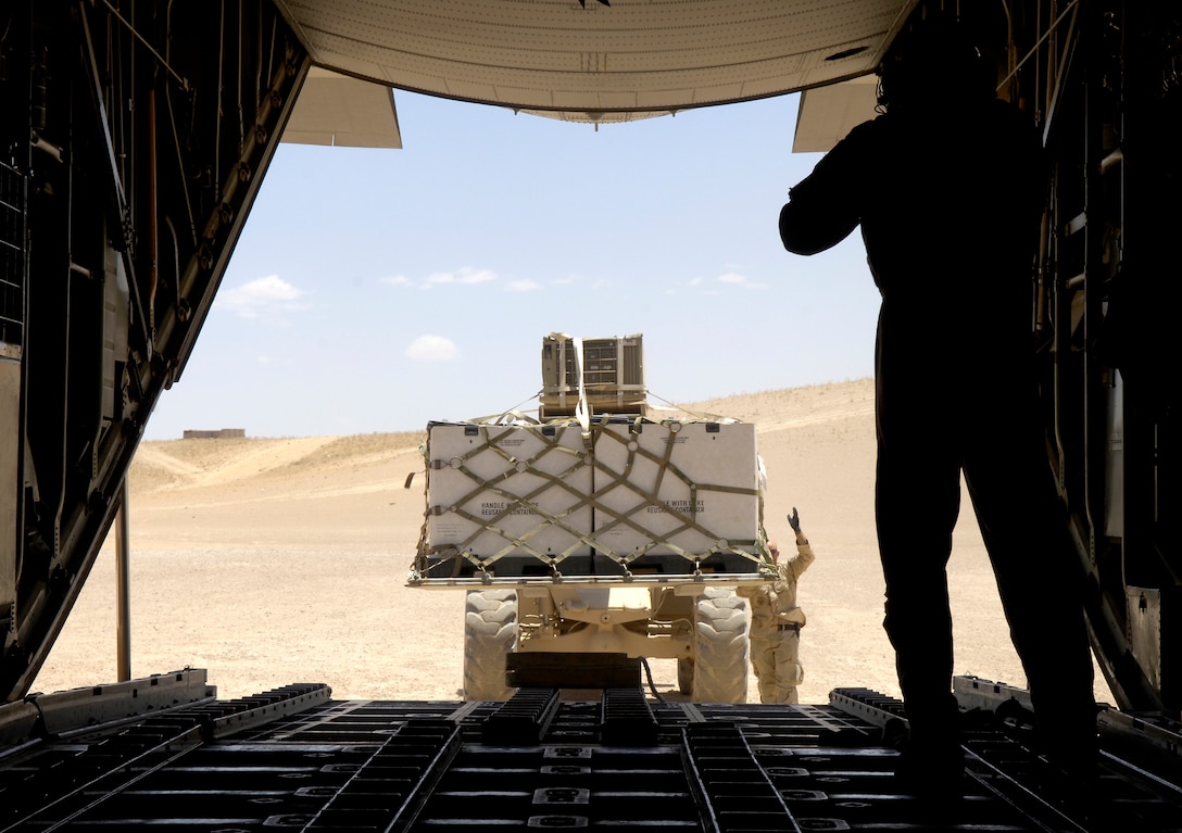 A forklift loads cargo onto a C-130 Hercules on a dirt runway in Tarin Kowt, Afghanistan, on Wednesday, June 14. The Hercules is with the 774th Expeditionary Airlift Squadron, the only U.S. C-130 squadron in Afghanistan. The squadron flies approximately five missions a day providing airlift and airdrops to troops in theater. (U.S. Air Force photo/Senior Airman Brian Ferguson) 