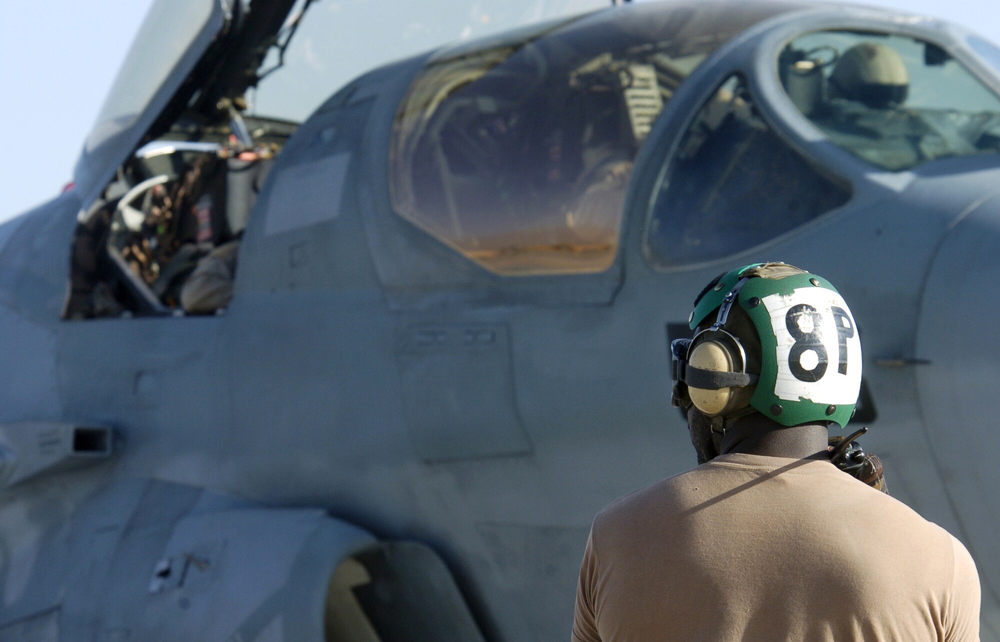 Crewmembers of a Navy EA-6B Prowler perform pre-flight checks before takeoff from Bagram Air Base, Afghanistan, on Thursday, June 15. Air Force and Navy crewmembers here fly the Prowler, providing support to ground troops in Afghanistan. (U.S. Air Force photo/Senior Airman Brian Ferguson)