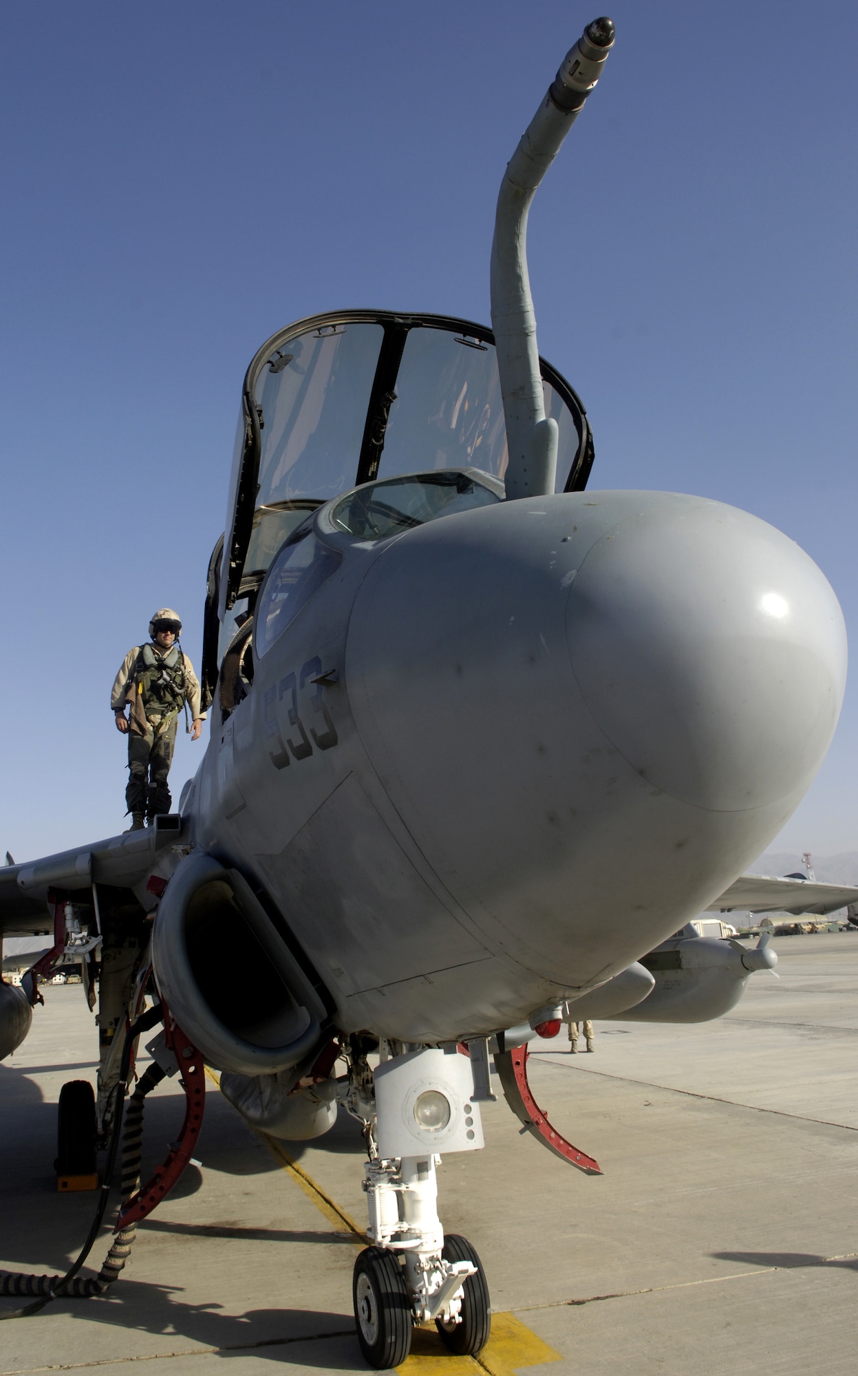 Air Force Capt. Matthew Polus checks a Navy EA-6B Prowler before take-off from Bagram Air Base, Afghanistan, on Thursday, June 15. Captain Polus is an electronic countermeasures officer with the Electronic Attack Squadron 133 Wizards. Air Force and Navy crewmembers fly the Prowler, providing support to ground troops in Afghanistan. (U.S. Air Force photo/Senior Airman Brian Ferguson) 