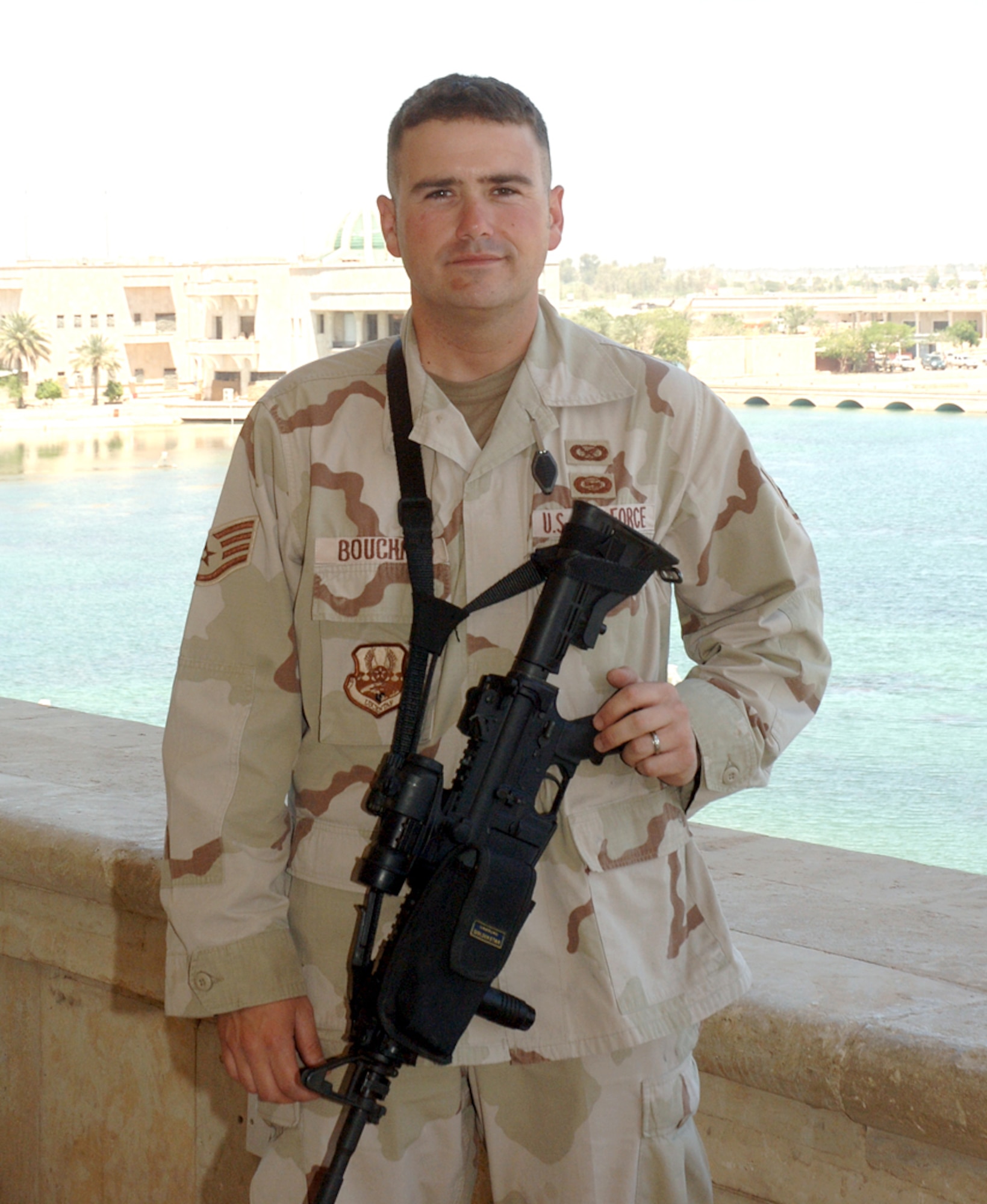 Staff Sgt. Bryan Bouchard, Air Force NCO of the Year for Public Affairs, stands outside a palace in Baghdad, Iraq.