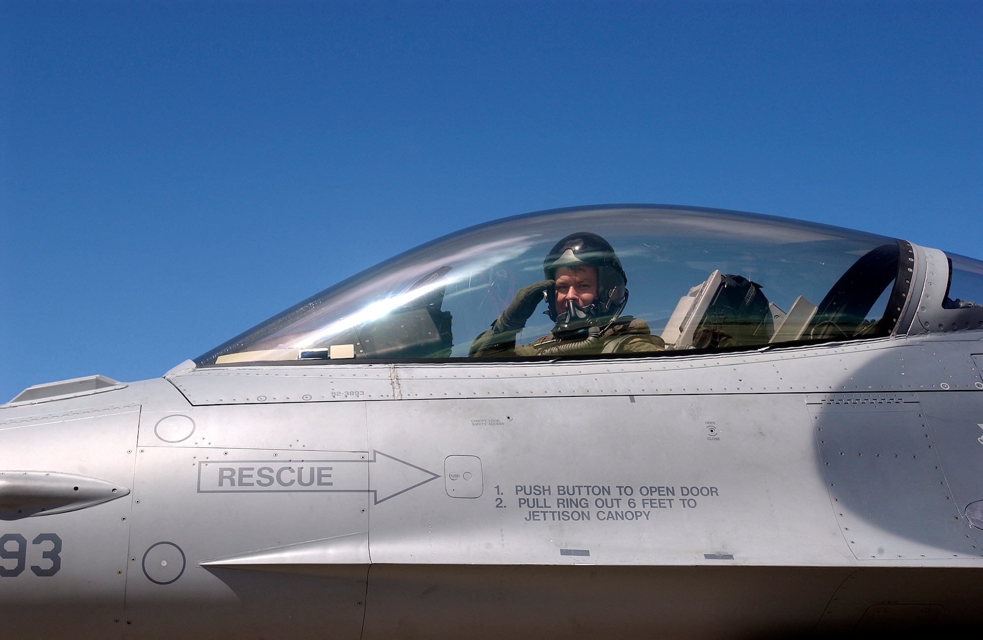 Capt. Eric Freienmuth salutes after landing following a training sortie for Valiant Shield 2006 at Andersen Air Force Base, Guam, on Monday, June 19. Valiant Shield focuses on integrated joint training and interoperability among U.S. military forces while responding to a range of mission scenarios. Captain Freienmuth is assigned to the 13th Fighter Squadron at Misawa Air Base, Japan. (U.S. Air Force photo/Airman 1st Class Michael S. Dorus)