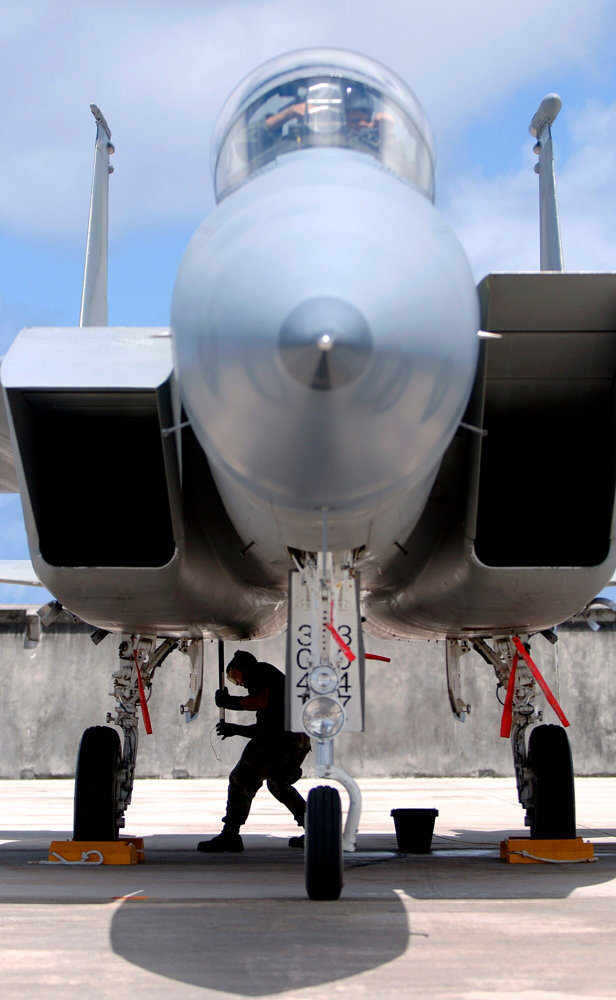 An F-15E Strike Eagle crew chief from Elmendorf Air Force Base, Alaska, parks the aircraft after a training sortie at Exercise Valiant Shield 2006 on Monday, June 19, at Andersen AFB, Guam. Valiant Shield, a U.S. Pacific Command exercise, runs June 19 to 23. It focuses on integrated joint training and interoperability among U.S. military forces while responding to a range of mission scenarios. (U.S. Air Force photo/Staff Sgt. Bennie J. Davis III) 