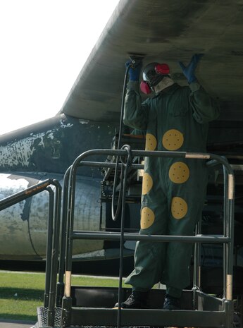 A member of the 315th Maintenance Squadron, Charleston AFB, S.C. preps the C-141 Starlifter residing in Heritage Park for a new paint job. The new paint job will reflect the historical paint scheme of the final C-141 that recently retired during a ceremony at Wright-Patterson Air Force Base, Ohio. (Photo by 1st Lt. Wayne Capps, USAFR)
