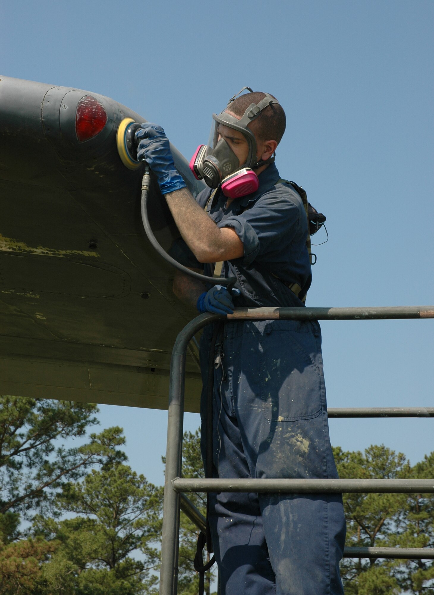 Senior Airman Ryan Mungavin, a reservist assigned to the 315th Maintenance Squadron, Charleston AFB, S.C. preps the C-141 Starlifter residing in Heritage Park for a new paint job. The new paint job will reflect the historical paint scheme of the final C-141 that recently retired during a ceremony at Wright-Patterson Air Force Base, Ohio. (Photo by 1st Lt. Wayne Capps, USAFR)