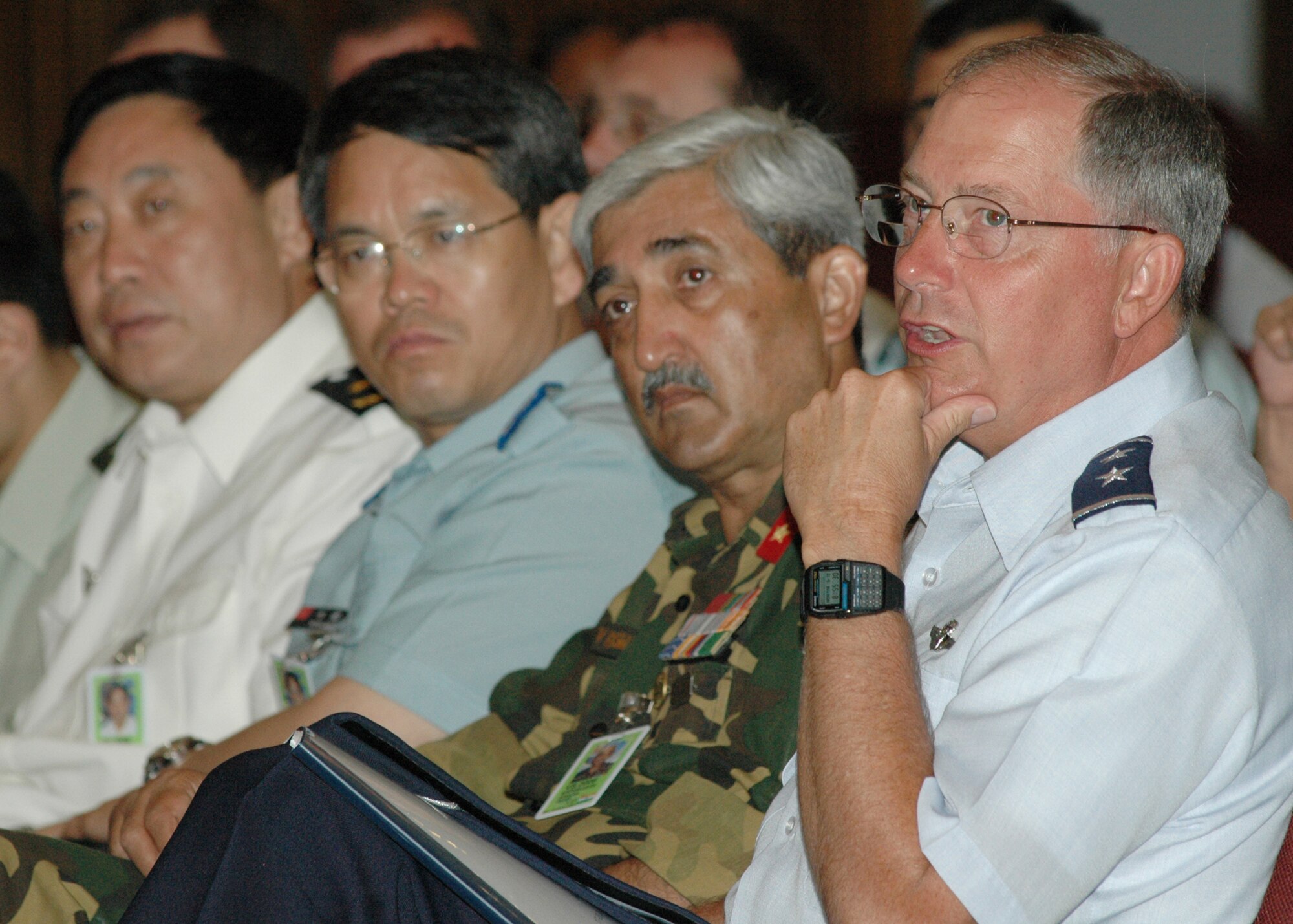 Santa Rita, Guam (June 19, 2006) – Maj. Gen Loyd Utterback, USAF Deputy Commander, Joint Task Force 519 is joined by Australia, China, India, Japan, Korea, Russia and Singapore dignitaries for a command brief presented by Capt Janice Wynn, Chief of Staff, Commander Naval Forces Marianas at the Naval Base Guam theatre.  The group toured Naval Base Guam and observed demonstrations by Naval Special Warfare Unit One, Explosive Ordnance Disposal Mobile Unit Five, and Mobile Security Squadron Seven.  The thirty three foreign dignitaries are currently here to observe the U.S. Pacific Command exercise Valiant Shield 2006 which involves approximately 22,000 Sailors, Airmen, Marines, Soldiers and Coast Guardsmen, one of the largest joint-military exercises in the Pacific in more than a decade. (U.S. Navy photo by PH2 (AW) John F. Looney)