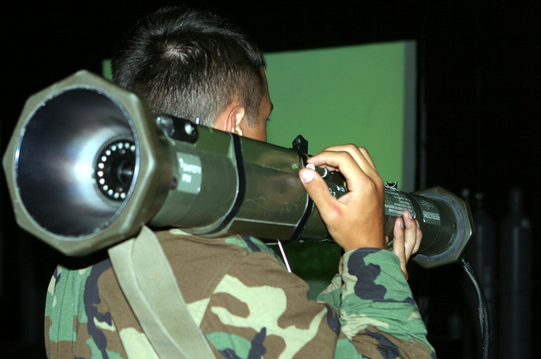 MARINE CORPS BASE CAMP LEJEUNE, N.C. (June 21, 2006) ? A Naval Reserve Officer Training Corps student operates an AT-4 anti-tank weapon at the Indoor Simulated Marksmanship Training system here. The students are a group of many who will pass through Camp Lejeune during their summer Career Orientation Training for Midshipmen, and are trained by various fleet Marines during their tour.