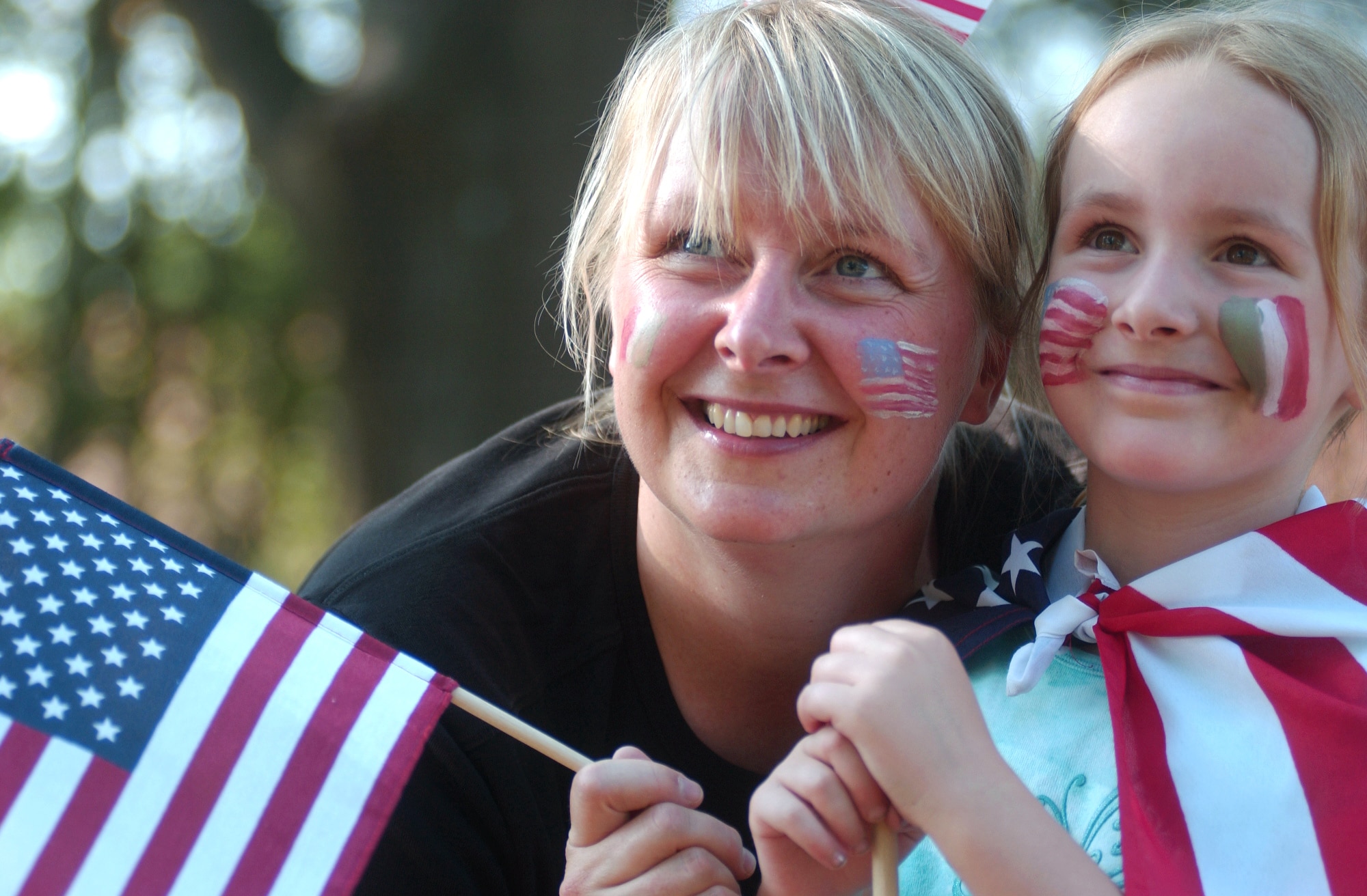 Mother and daughter, Sari and Serena Dechellis, show off their American and Italian face-painting flags in honor of the U.S.A. vs. Italy World Cup soccer match at the World Cup Fest at Pulaski Park in Kaiserslautern, Germany, on Saturday, June 17. (U.S. Army photo/Christine June) 
